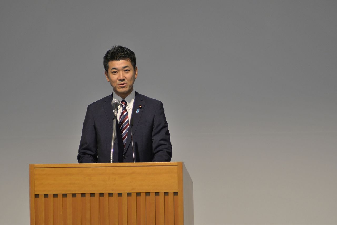 FILE PHOTO: Kenta Izumi, policy chief of the Democratic Party for the People, delivers a speech after Yukio Edano won the leadership race for the major opposition party in Tokyo, Japan September 10, 2020. David Mareuil/Pool via REUTERS