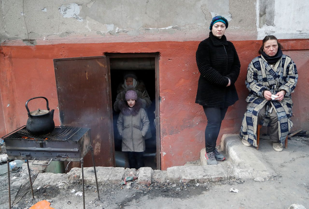 Local residents, who seek refuge in the basement of a building during Ukraine-Russia conflict, are seen in the besieged southern port city of Mariupol, Ukraine March 17, 2022. REUTERS/Alexander Ermochenko