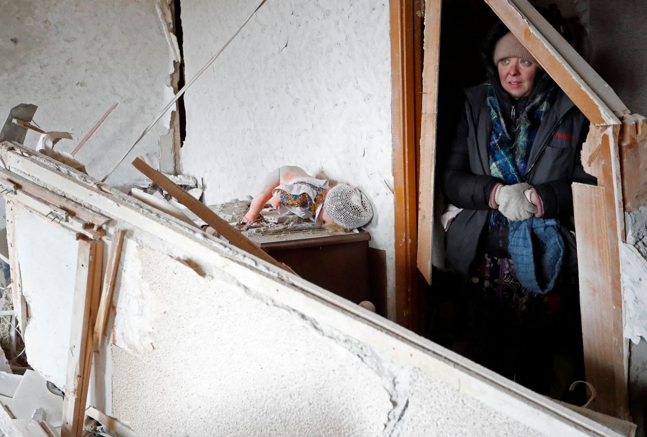 A local resident stands inside an apartment which was damaged during Ukraine-Russia conflict in the besieged southern port city of Mariupol, Ukraine March 18, 2022. REUTERS/Alexander Ermochenko