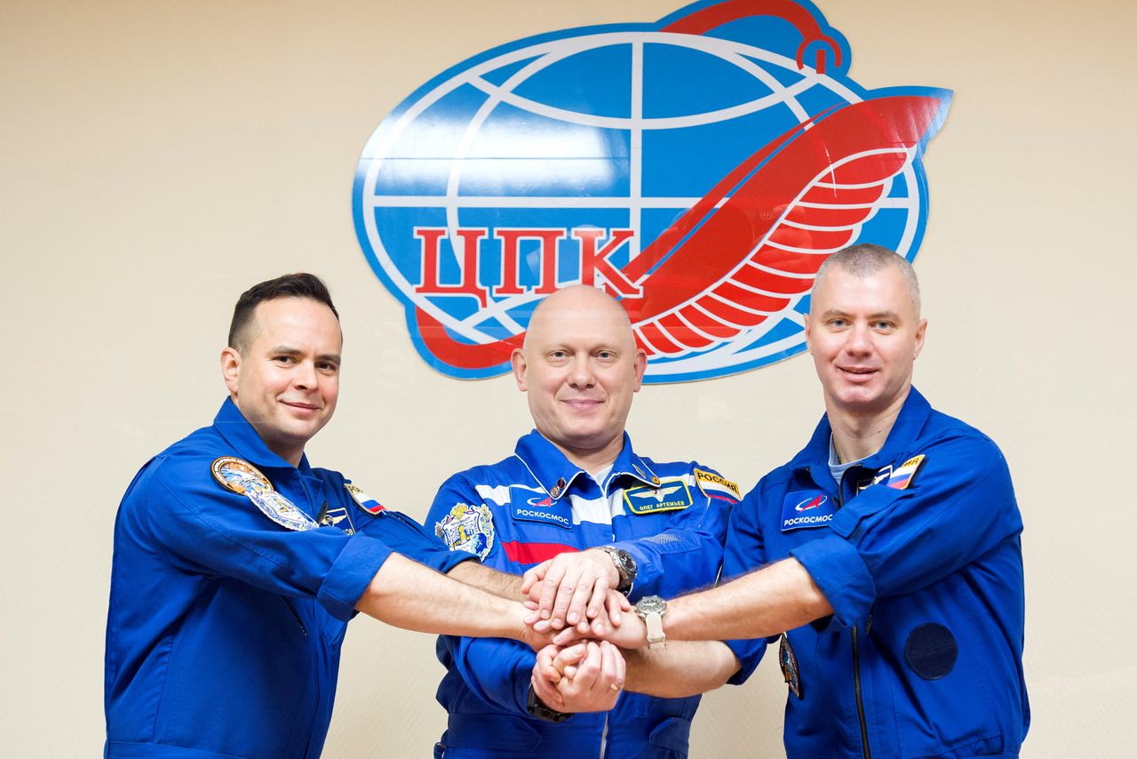 Russian cosmonauts Oleg Artemyev, Denis Matveev and Sergey Korsakov pose for a picture during a news conference ahead of the expedition to the International Space Station (ISS) at the Baikonur Cosmodrome, Kazakhstan March 17, 2022. Roscosmos/Handout via REUTERS