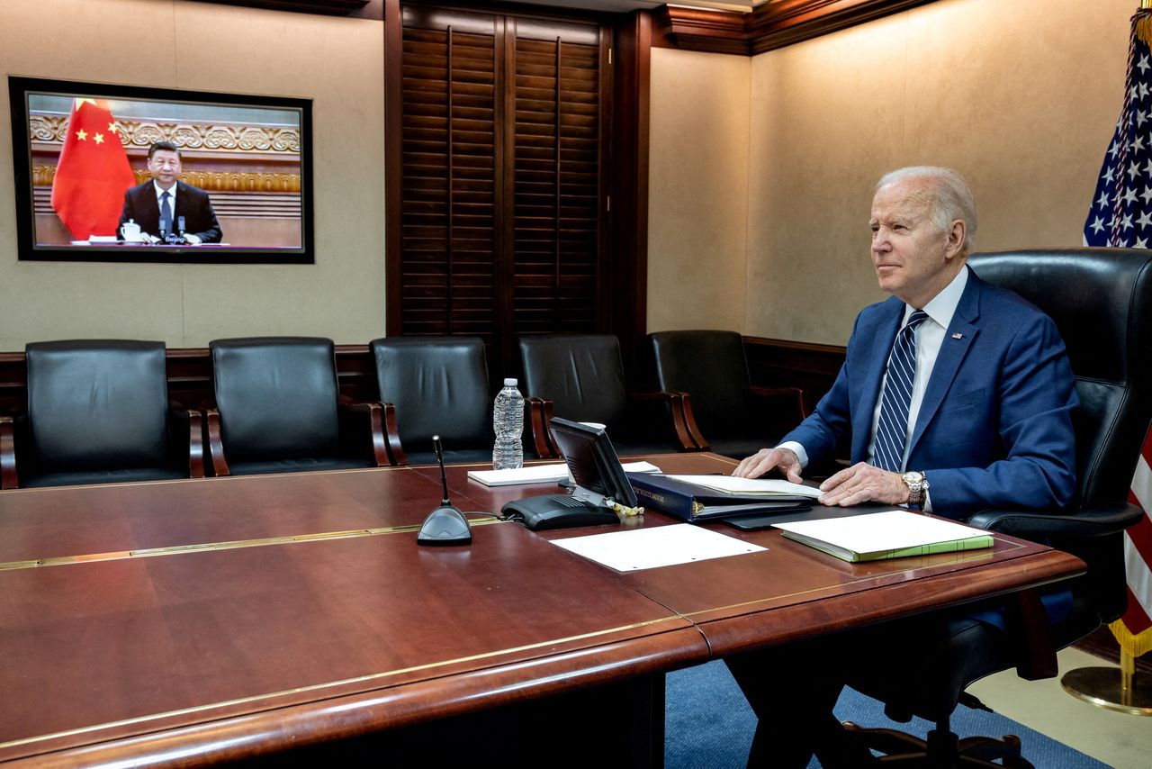 FILE PHOTO: U.S. President Joe Biden holds virtual talks with Chinese President Xi Jinping from the Situation Room at the White House in Washington, U.S., March 18, 2022. The White House/Handout via REUTERS