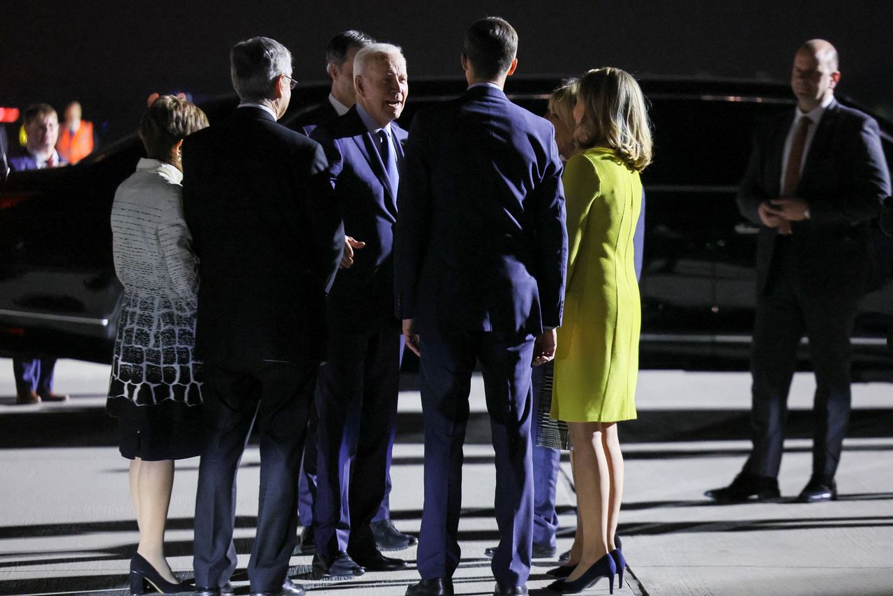 A Belgian delegation welcomes U.S. President Joe Biden, who arrives to attend an extraordinary NATO summit to discuss ongoing deterrence and defense efforts in response to Russia