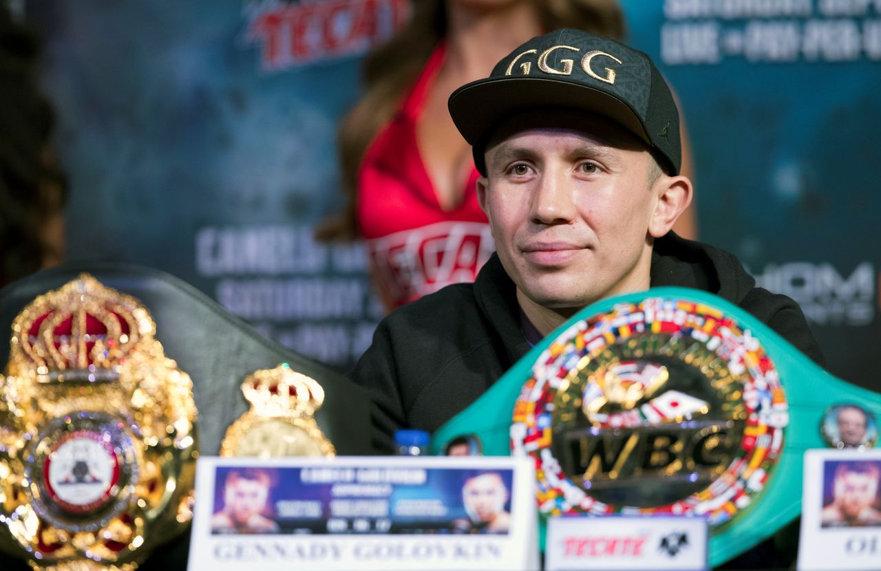 WBC/WBA/IBF middleweight champion Gennady Golovkin of Kazakhstan sits behind his belts during a news conference at MGM Grand hotel and casino in Las Vegas, Nevada, U.S. September 13, 2017. REUTERS/Las Vegas Sun/Steve Marcus/Files