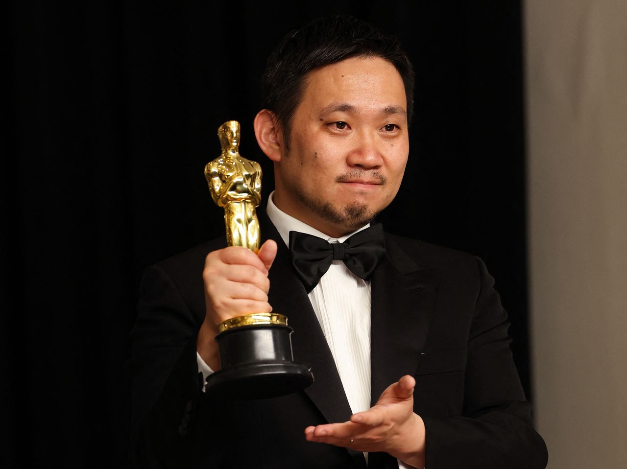 Director Ryusuke Hamaguchi poses with the Oscar for Best International Feature Film for "Drive My Car" of Japan in the photo room during the 94th Academy Awards in Hollywood, Los Angeles, California, U.S., March 27, 2022.  REUTERS/Mario Anzuoni