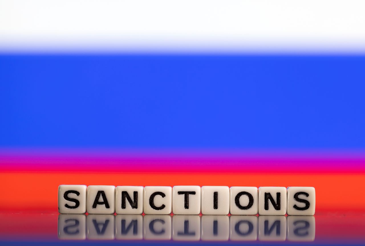 FILE PHOTO: Plastic letters arranged to read "Sanctions" are placed in front of Russian flag colors in this illustration taken February 25, 2022. REUTERS/Dado Ruvic/Illustration
