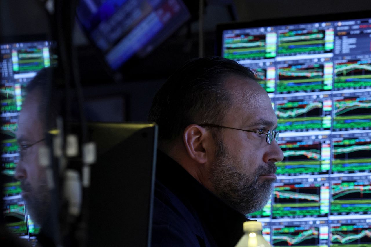 A specialist trader works inside his post on the floor of the New York Stock Exchange (NYSE) in New York City, U.S., March 10, 2022.  REUTERS/Brendan McDermid