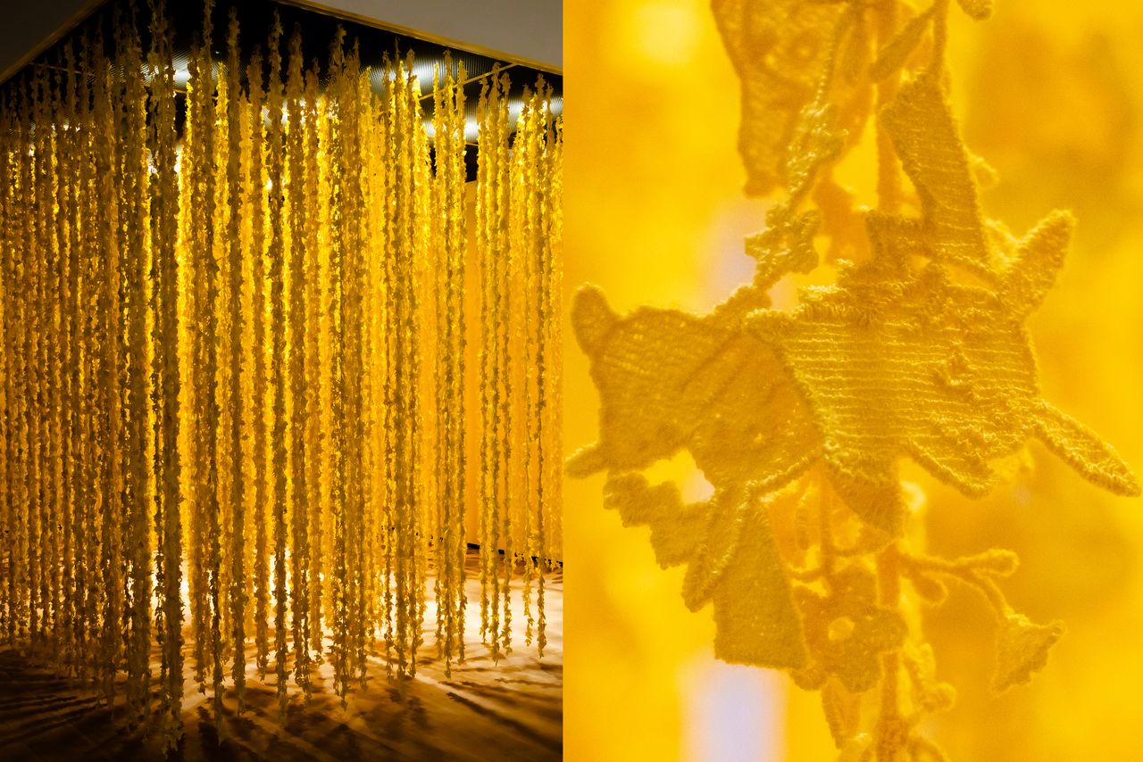 Sudō Reiko, in Pikachū’s Adventures in a Forest, creates a golden-hued space enveloped in some 900 needle-lace hangings featuring the most famous Pokémon of all. (© Nippon.com)