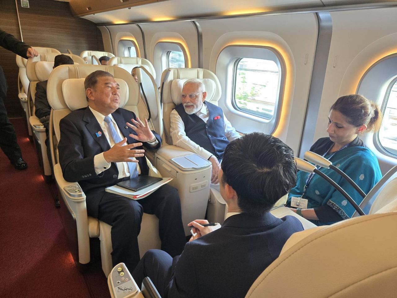 Prime Minister Ishiba, in the aisle seat, and Prime Minister Modi aboard the Tōhoku Shinkansen on August 30, 2025. (Via Ishiba Shigeru’s X account; © Jiji)