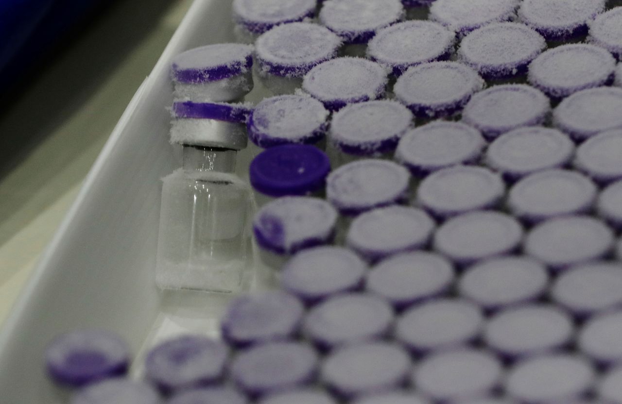 FILE PHOTO: Vials taken out from a pharmaceutical refrigerator are pictured during a mock inoculation exercise, as Japan prepares for coronavirus disease (COVID-19) vaccination campaign, at a college gym in Kawasaki, south of Tokyo, Japan, January 27, 2021. REUTERS/Kim Kyung-Hoon