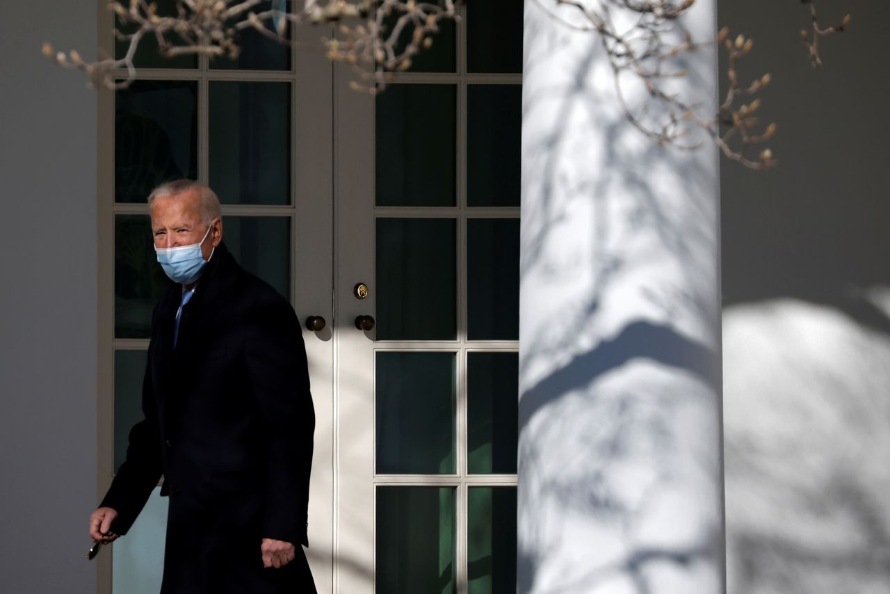 FILE PHOTO: U.S. President Joe Biden walks into the Oval Office as he arrives from New Castle, Delaware at the White House in Washington, U.S., February 8, 2021. REUTERS/Carlos Barria