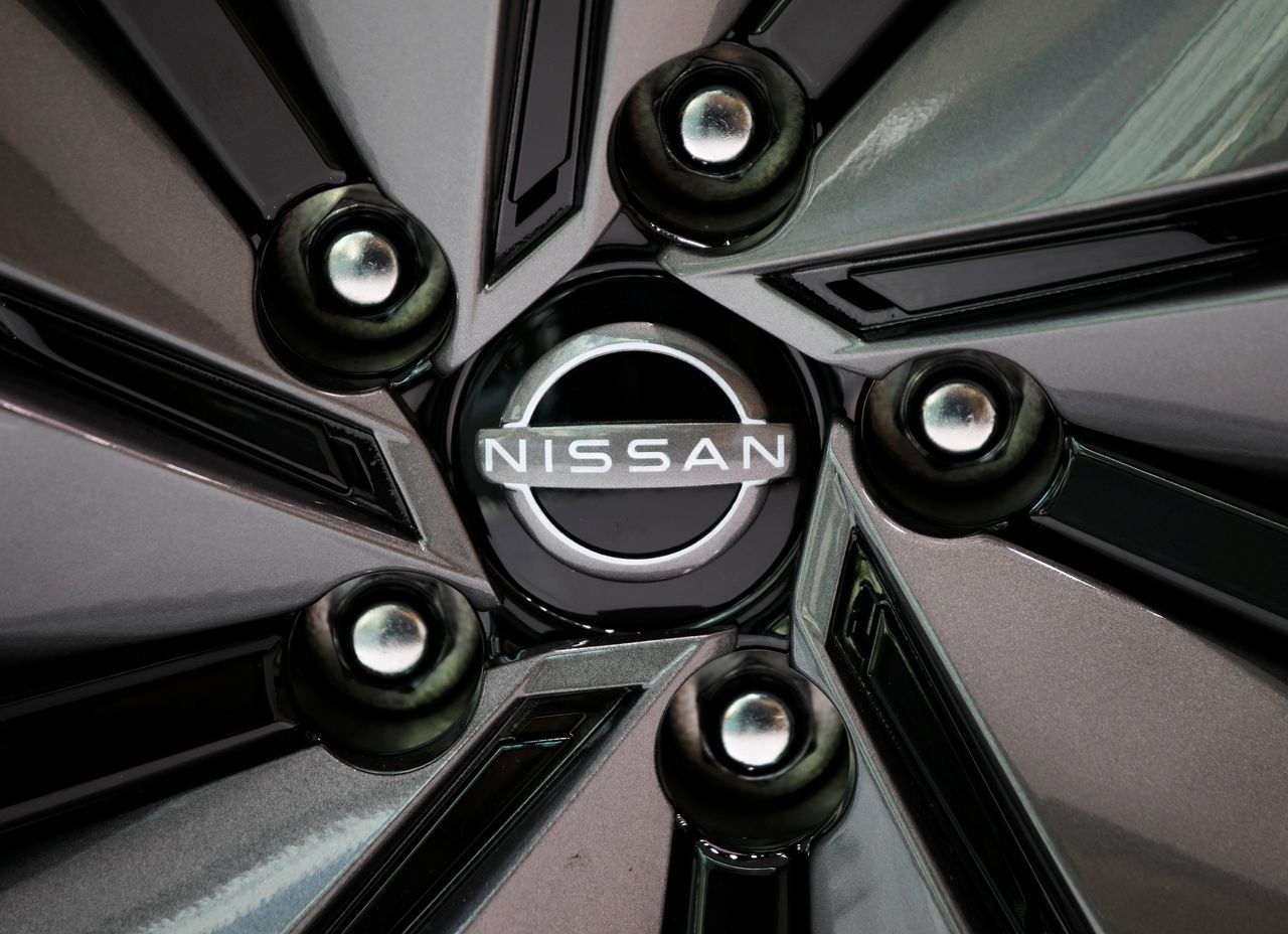 FILE PHOTO: The brand logo of Nissan Motor Corp. is seen on a tyre wheel of the company's car at their showroom in Tokyo, Japan November 11, 2020. REUTERS/Issei Kato