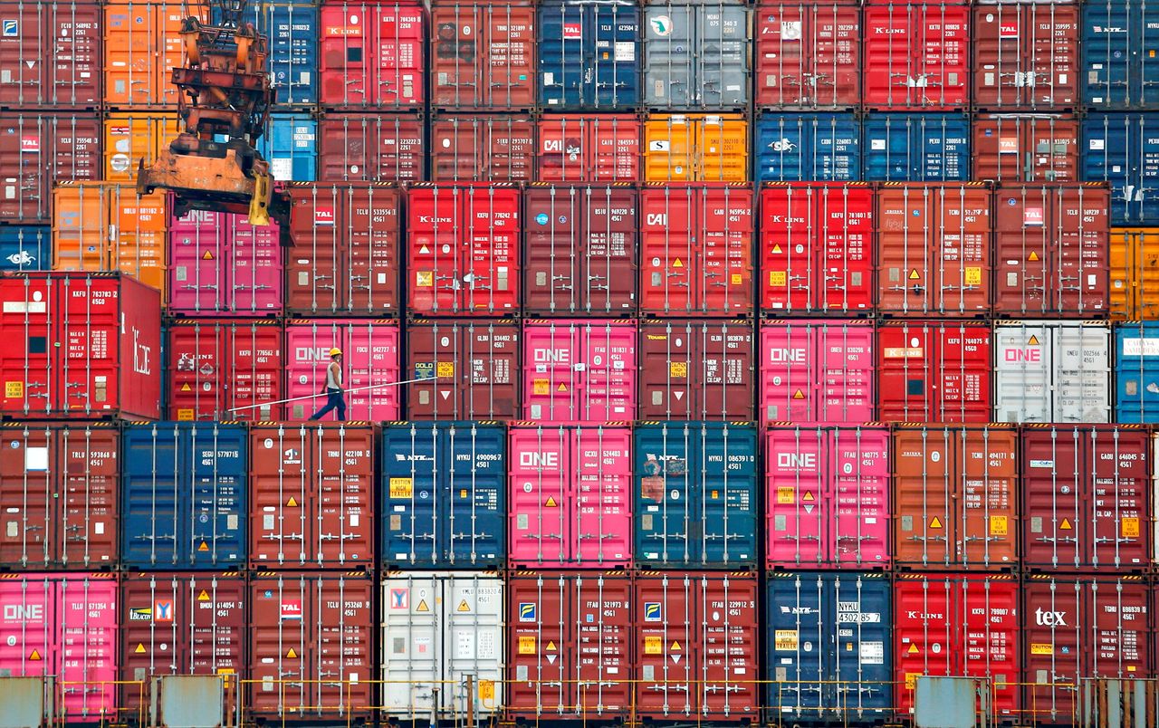 FILE PHOTO: A worker walks on stacks of containers at the Tanjung Priok port in Jakarta, Indonesia, January 22, 2021. REUTERS/Ajeng Dinar Ulfiana/File Photo