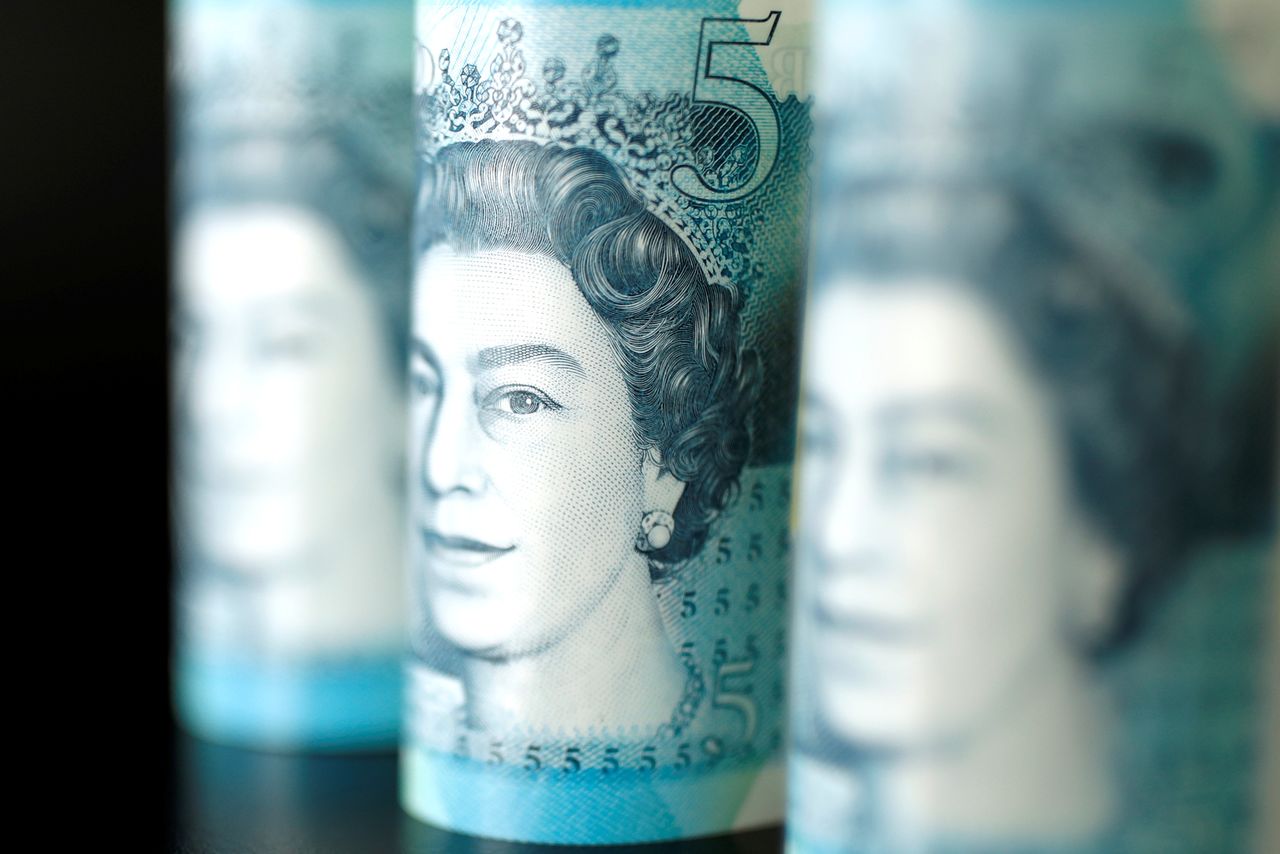 FILE PHOTO: British five pound banknotes are seen in this picture illustration taken November 14, 2017. REUTERS/ Benoit Tessier/Illustration