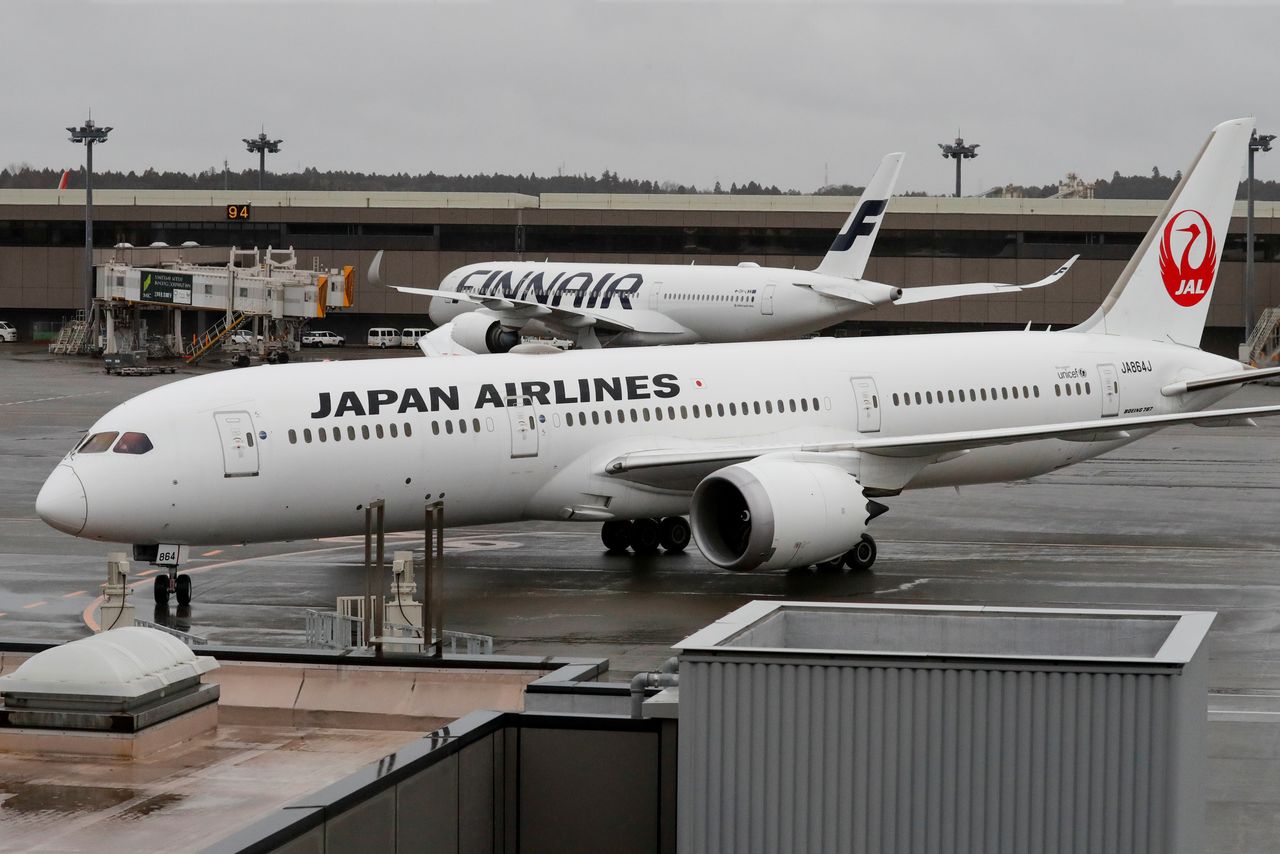 A plane, believed to carry U.S. citizens Michael Taylor and his son Peter Taylor, who are suspected of helping former Nissan Motor Chairman Carlos Ghosn to escape to Lebanon, arrive at Narita airport, following Taylors' extradition to Japanese prosecutors, in Chiba, Japan, March 2, 2021. REUTERS/Kim Kyung-Hoon