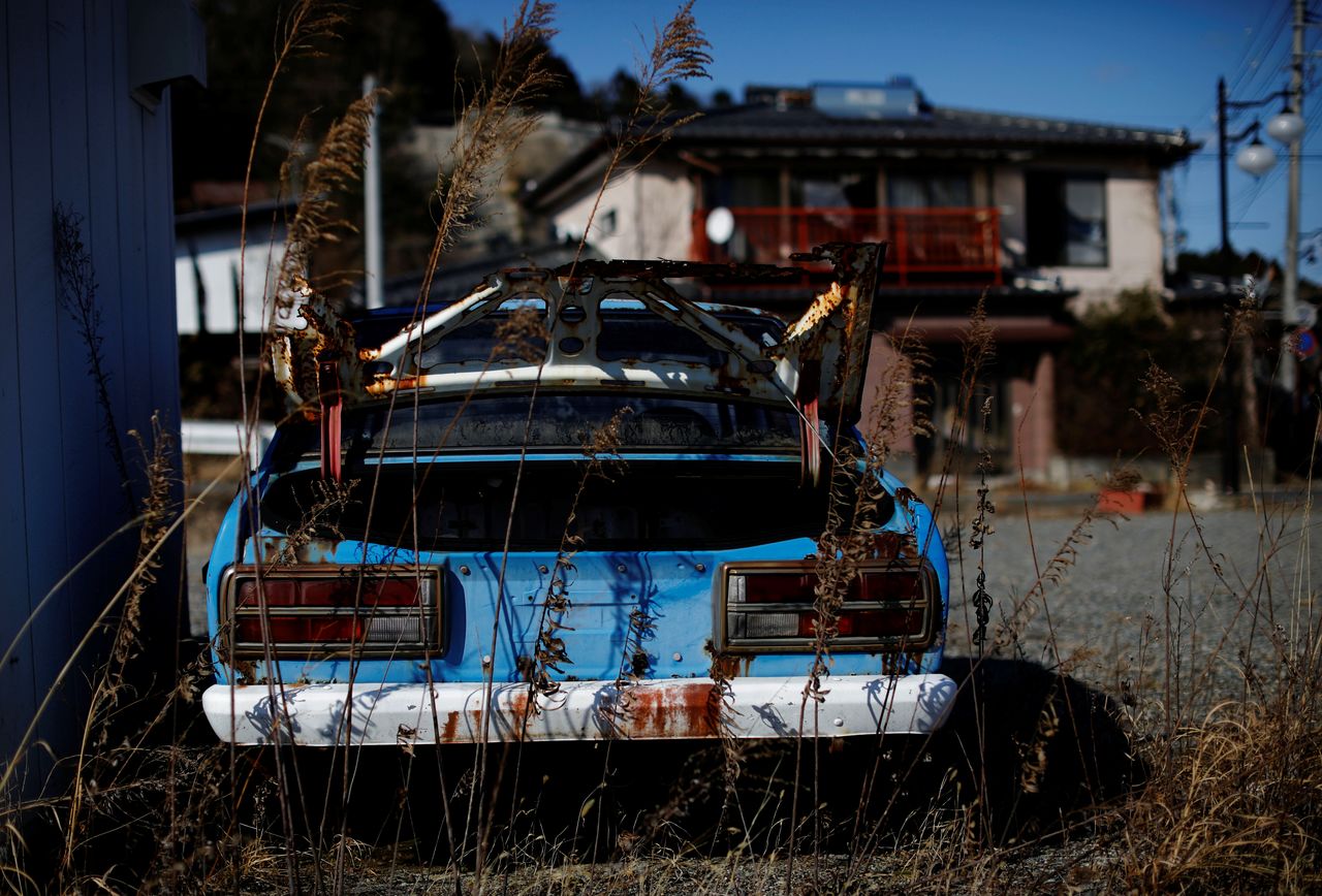 An abandoned car sits in a restricted zone in Futaba, Fukushima Prefecture, Japan, February 19, 2021. REUTERS/Kim Kyung-Hoon