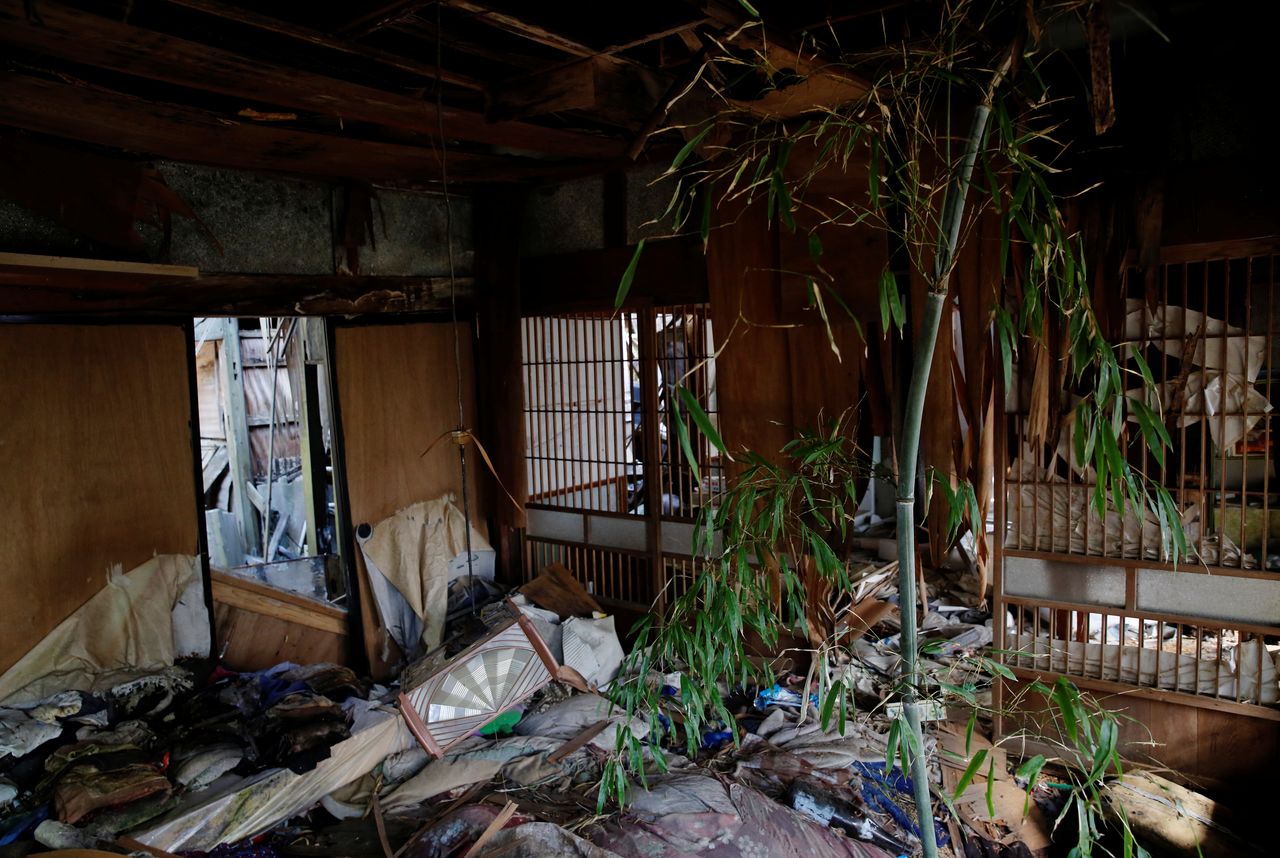 A bamboo tree grows inside Hisae Unuma's collapsing home that she lived in before being evacuated, which is 2.5 km away from the crippled Fukushima nuclear power plant, in a restricted zone in Futaba, Fukushima prefecture, Japan, February 23, 2021. Unuma fled as the cooling system at Tokyo Electric Power Co's nuclear plant failed and its reactors began to melt down. Her home withstood the earthquake a decade ago but is now close to collapsing after years of being battered by wind, rain and snow. I'm surprised it's still standing,