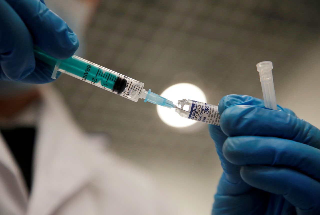 FILE PHOTO: A medical worker holds a syringe with Sputnik V vaccine against the coronavirus disease (COVID-19) at a vaccination centre in Saint Petersburg, Russia February 24, 2021. REUTERS/Anton Vaganov/File Photo