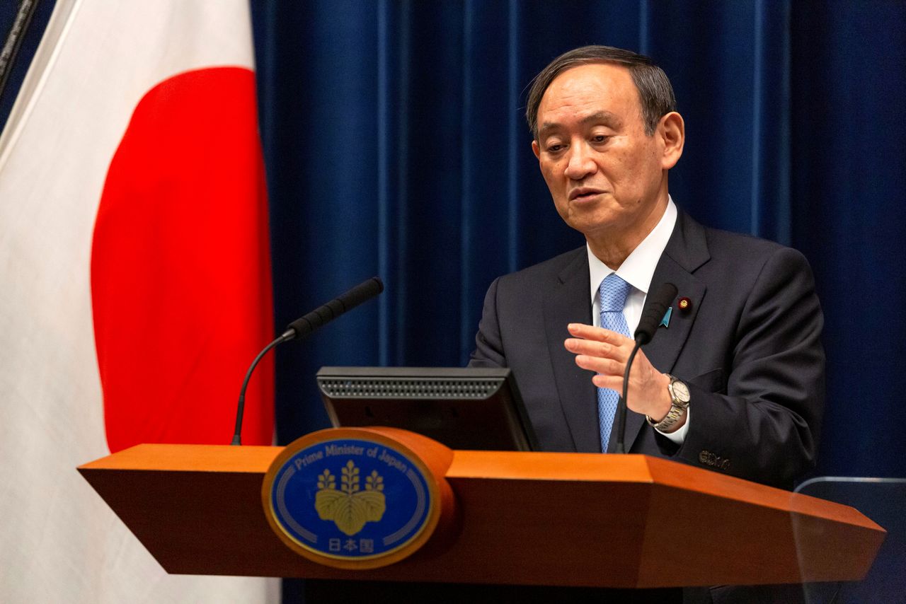 FILE PHOTO: Japanese Prime Minister Yoshihide Suga speaks during a news conference in Tokyo, Japan March 5, 2021. Yuichi Yamazaki/Pool via REUTERS