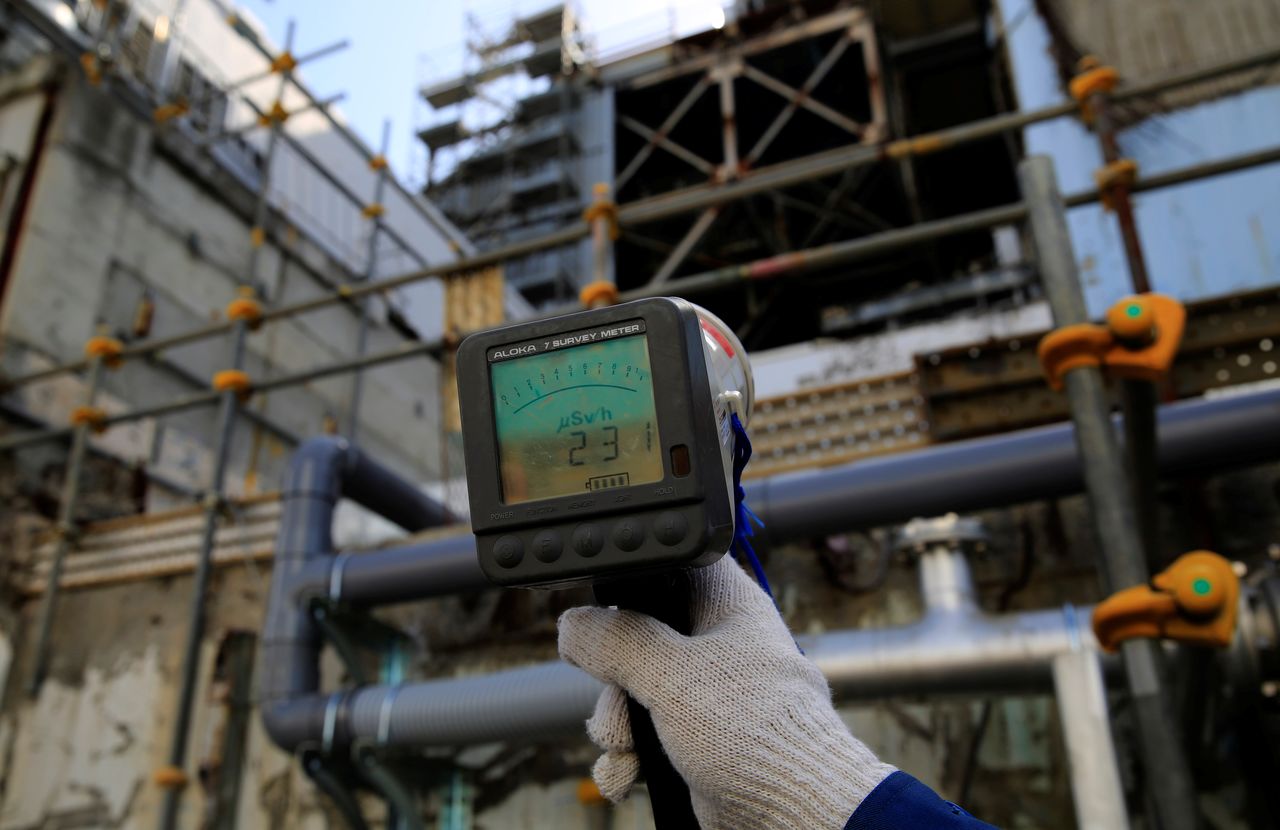 A Geiger counter shows a radiation level of 231 microsieverts per hour near the damaged No. 3 reactor building at the tsunami-crippled Fukushima Daiichi nuclear power plant in Okuma town, Fukushima prefecture, Japan March 1, 2021. Picture taken March 1, 2021. REUTERS/Sakura Murakami
