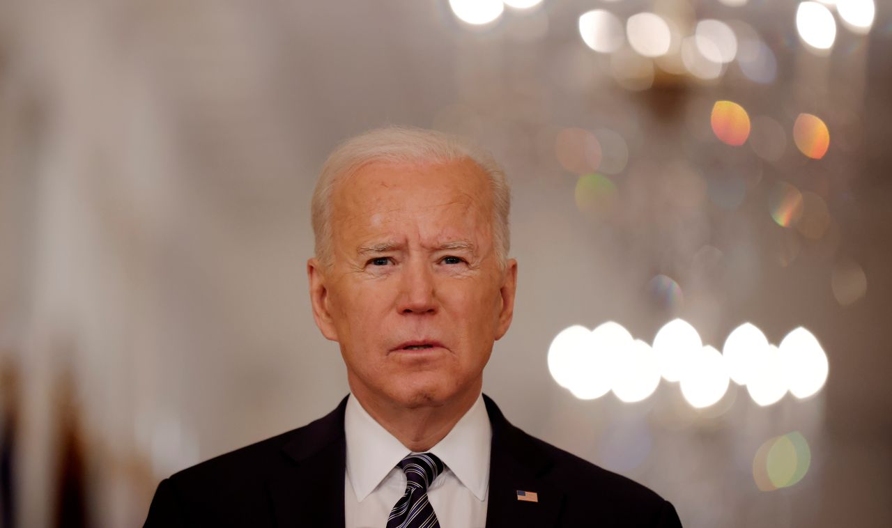FILE PHOTO: U.S. President Joe Biden delivers his first prime time address as president, marking the one-year anniversary of widespread shutdowns to combat the coronavirus disease (COVID-19) pandemic and speaking about the impact of the pandemic during an address from the East Room of the White House in Washington, U.S., March 11, 2021. REUTERS/Tom Brenner