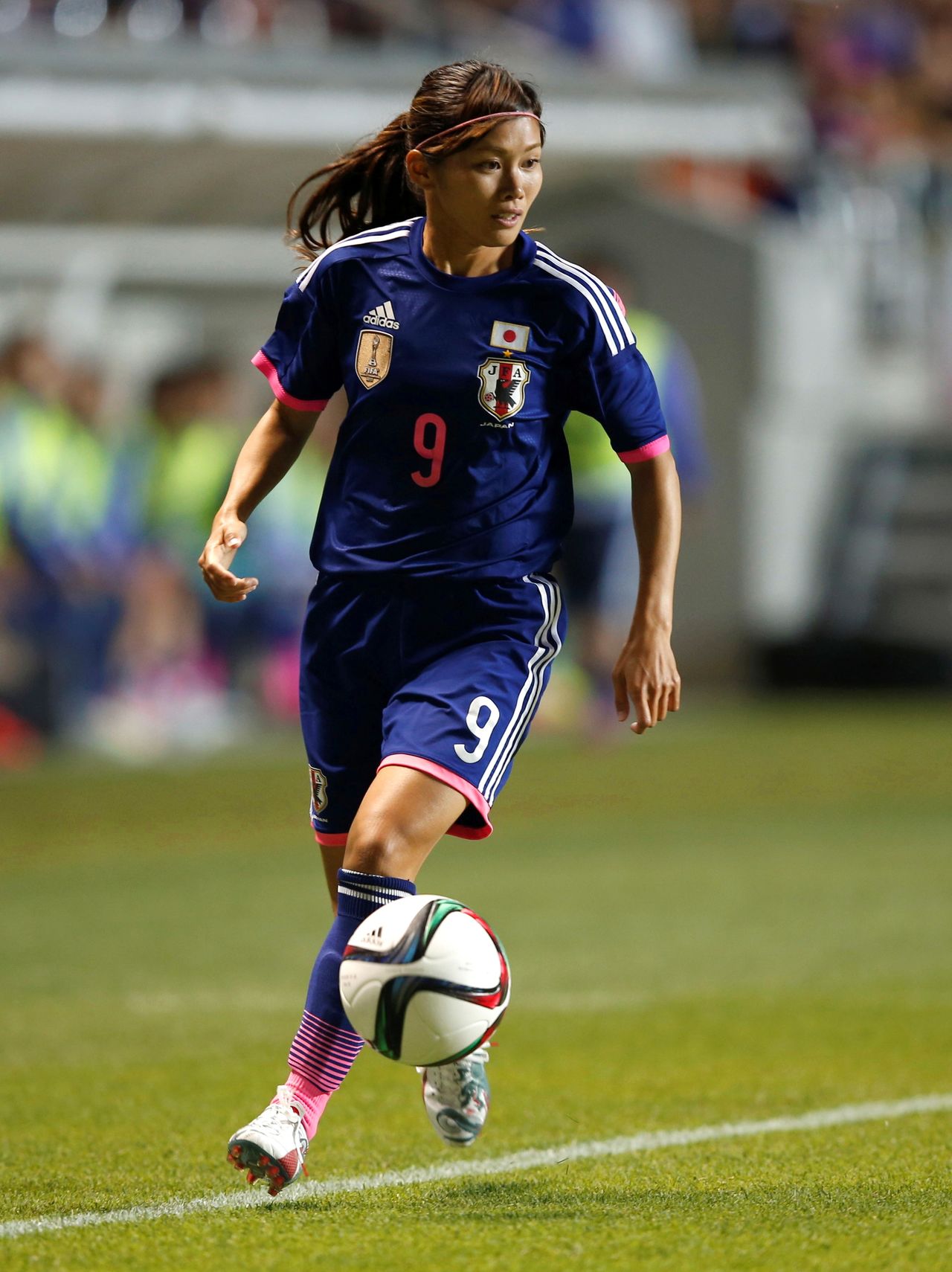 FILE PHOTO: Japan's Nahomi Kawasumi controls the ball during their women's international friendly soccer match against Italy in Nagano, central Japan, May 28, 2015. REUTERS/Toru Hanai/File Photo