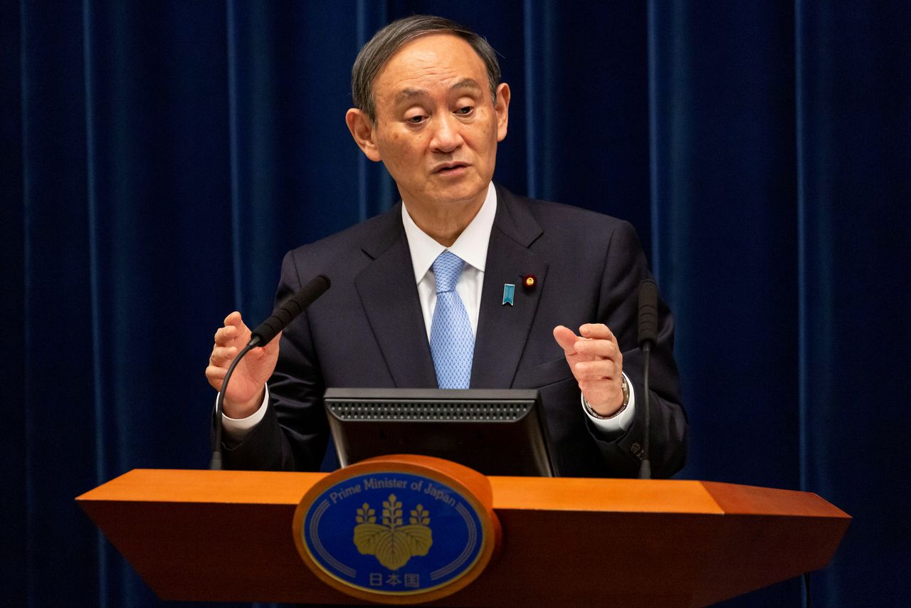 FILE PHOTO: Japanese Prime Minister Yoshihide Suga speaks during a news conference in Tokyo, Japan March 5, 2021. Yuichi Yamazaki/Pool via REUTERS