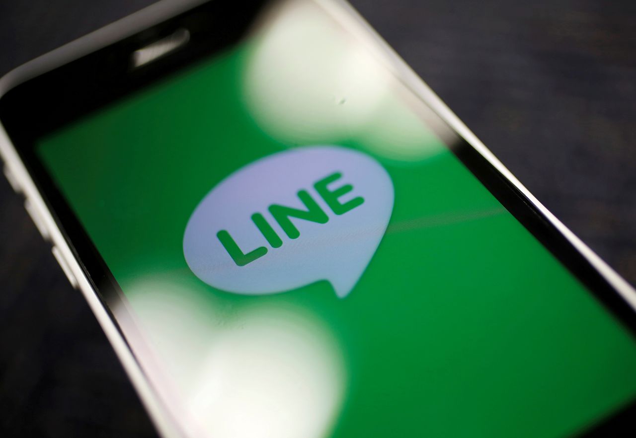 FILE PHOTO: The logo of free messaging app Line is pictured on a smartphone in this photo illustration taken in Tokyo, Japan September 23, 2014. REUTERS/Toru Hanai