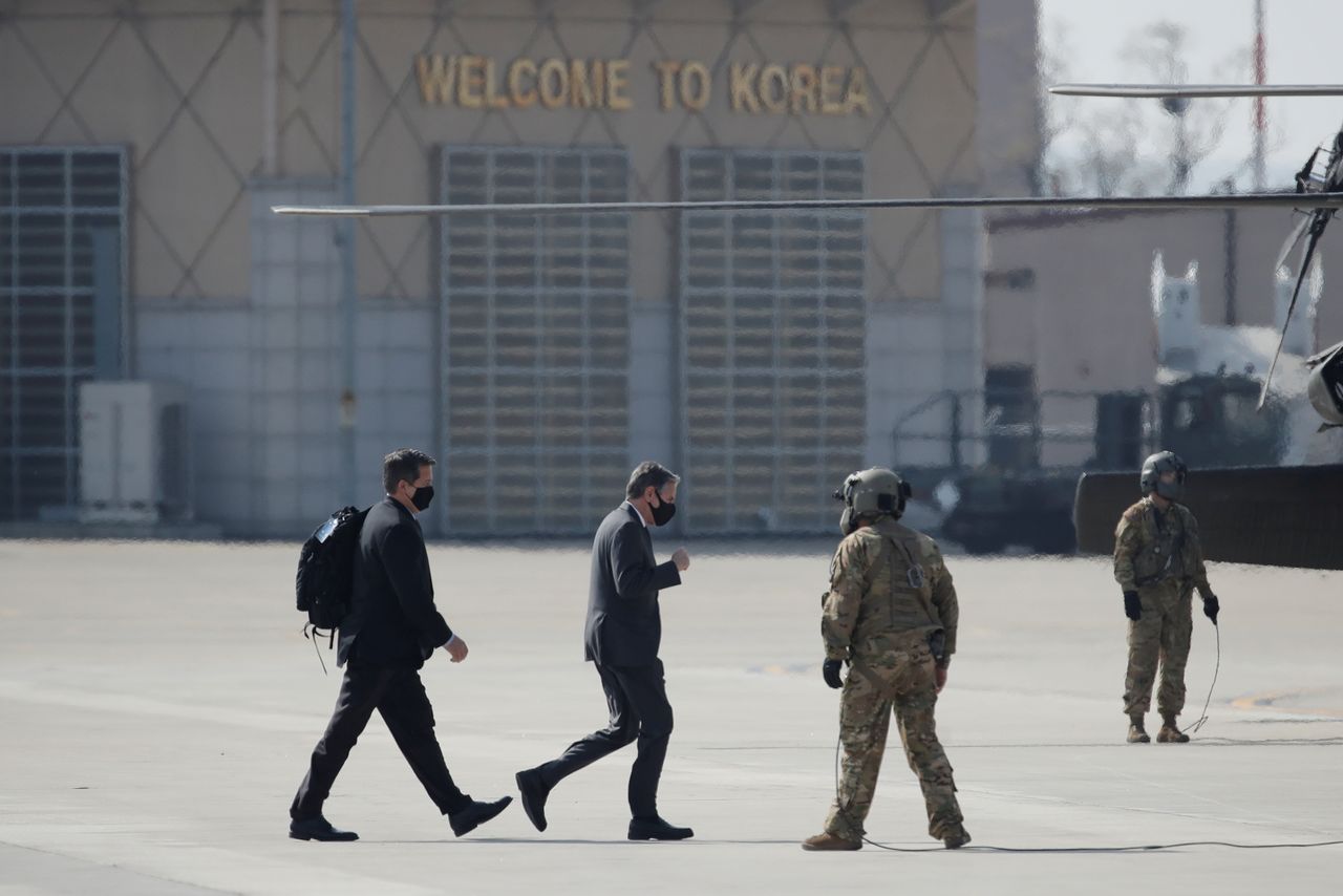 U.S. Secretary of State Antony Blinken, center, walks to board a helicopter upon his arrival at Osan Air Base in Pyeongtaek, South Korea March 17, 2021. Lee Jin-man/Pool via REUTERS