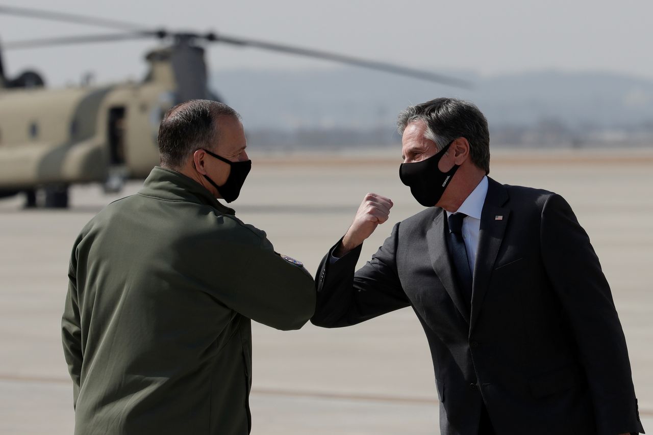 U.S. Secretary of State Antony Blinken, right, greets with Lieutenant General Scott Pleus, Deputy Commander of United States Forces Korea, upon his arrival at Osan Air Base in Pyeongtaek, South Korea March 17, 2021. Lee Jin-man/Pool via REUTERS