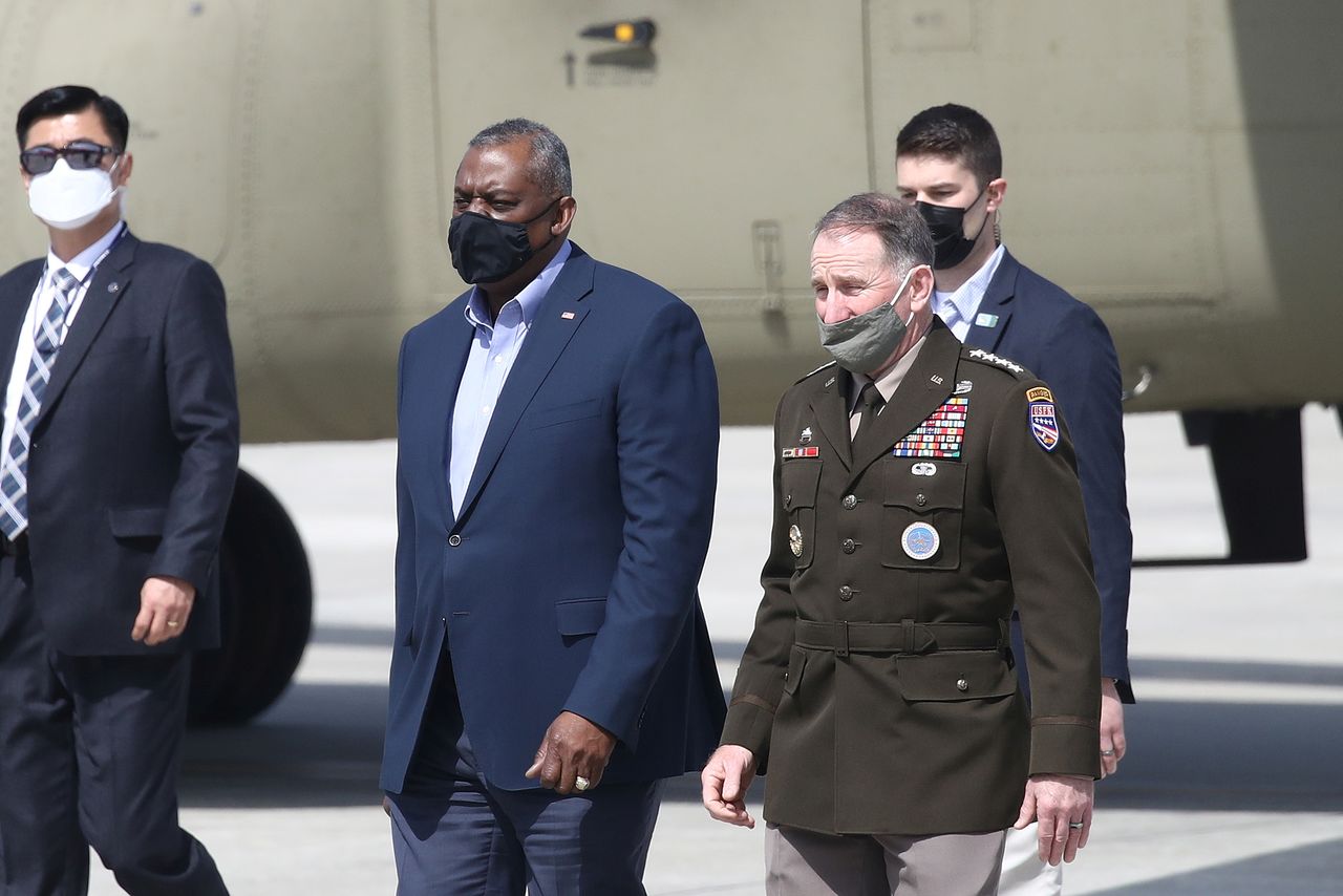 U.S. Defense Secretary Lloyd Austin walks with United States Forces Korea Gen. Robert B. Abrams after arriving at Osan Air Base in Pyeongtaek, South Korea March 17, 2021. Chung Sung-Jun/Pool via Reuters