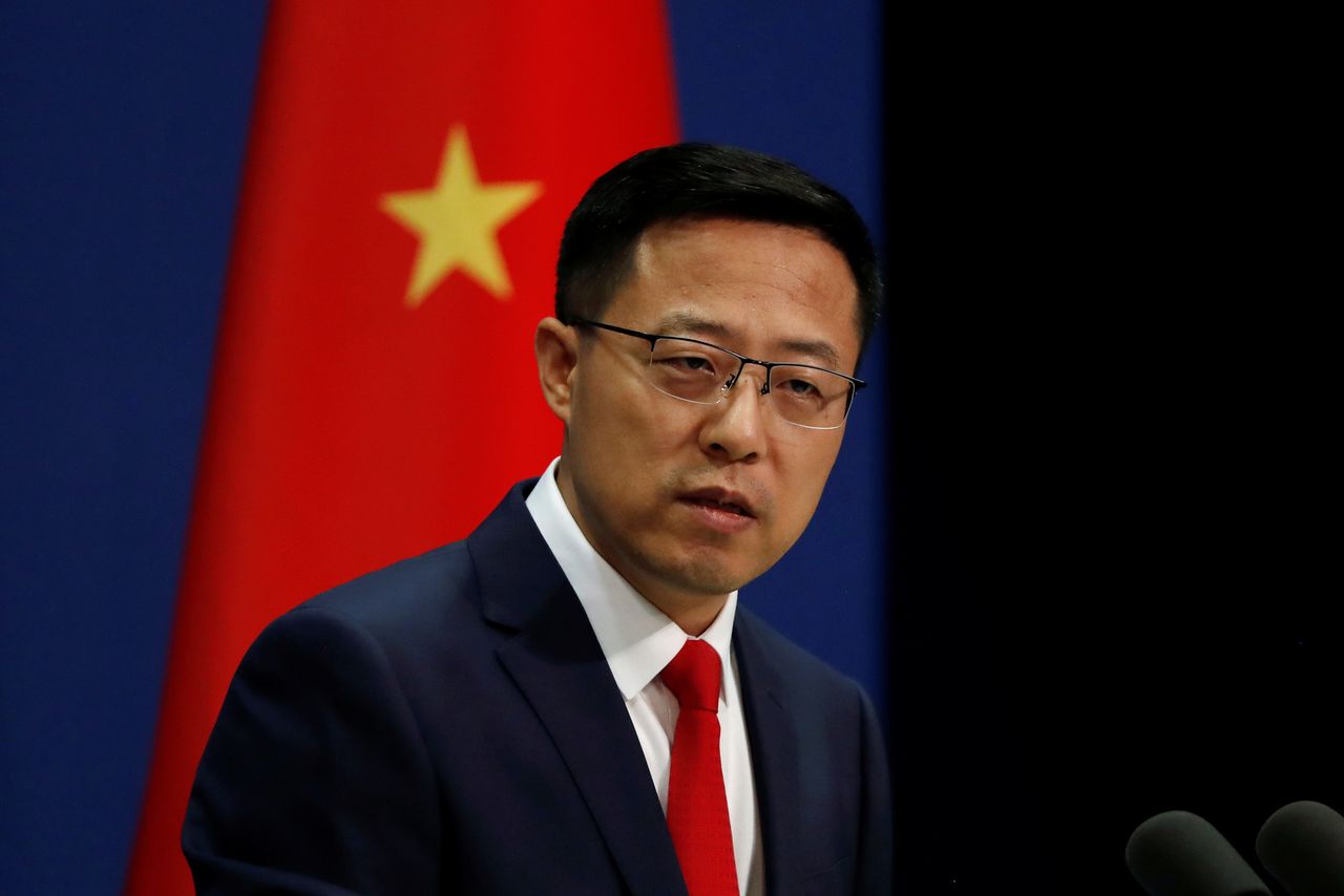 FILE PHOTO: Chinese Foreign Ministry spokesman Zhao Lijian attends a news conference in Beijing, China September 10, 2020. REUTERS/Carlos Garcia Rawlins
