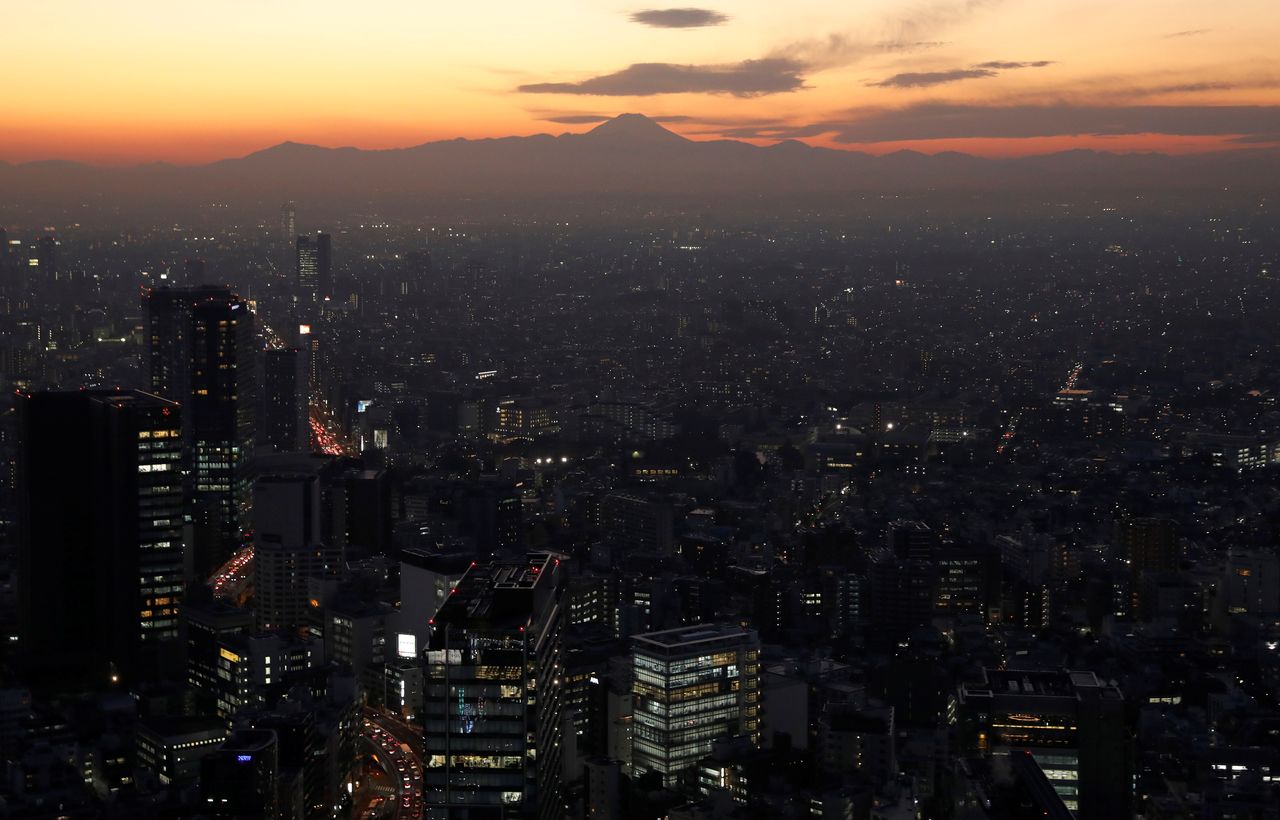 FILE PHOTO: Business buildings are pictured in Tokyo, Japan, December 7, 2020. REUTERS/Kim Kyung-Hoon