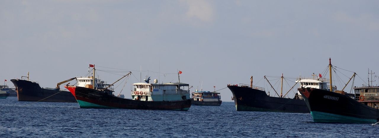 FILE PHOTO: Chinese fishing vessels are pictured at the disputed Scarborough Shoal April 6, 2017. REUTERS/Erik De Castro