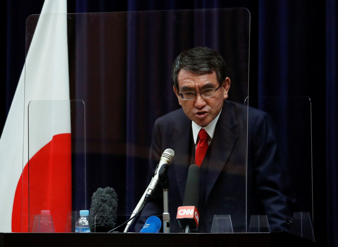 FILE PHOTO: Japan's vaccination programme chief Taro Kono attends a news conference on the country's preparations to begin vaccinating health workers, amid the coronavirus disease (COVID-19) outbreak, in Tokyo, Japan February 16, 2021. REUTERS/Issei Kato