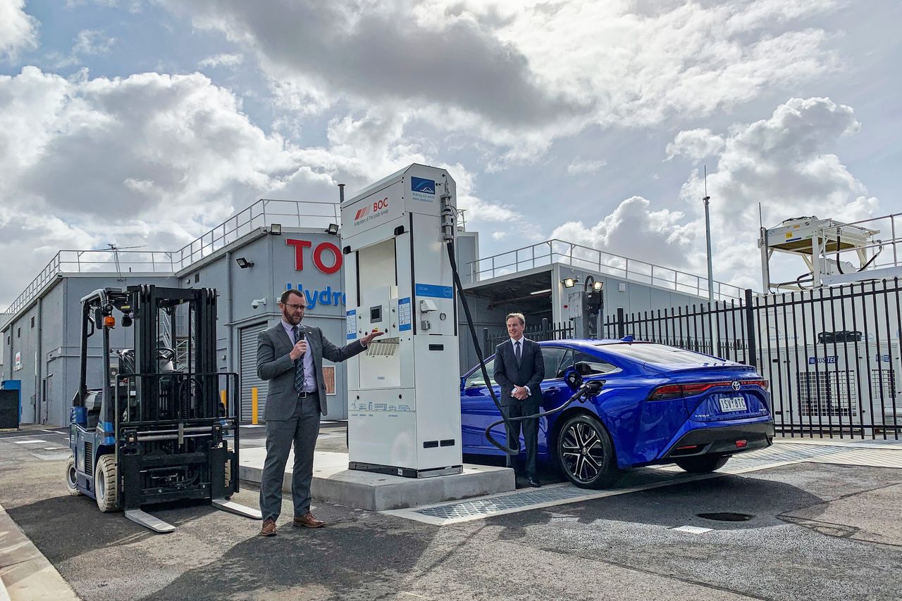 Toyota Australia's CEO Matthew Callachor (R) and Manager of Future Technologies and Mobility Matthew MacLeod stand at the hydrogen refuelling site that Toyota opened at their former car plant in the Altona suburb of Melbourne, Australia, where it is producing hydrogen by using rooftop solar to power an electrolyser to split water, March 29, 2021. REUTERS/Sonali Paul