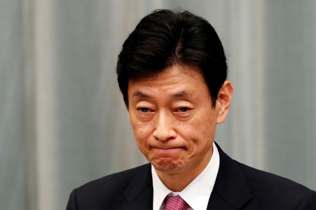 FILE PHOTO: Japan's Minister in charge of economic revitalisation and measures for the novel coronavirus pandemic Yasutoshi Nishimura attends a news conference in Tokyo, Japan, September 16, 2020. REUTERS/Kim Kyung-Hoon/File Photo