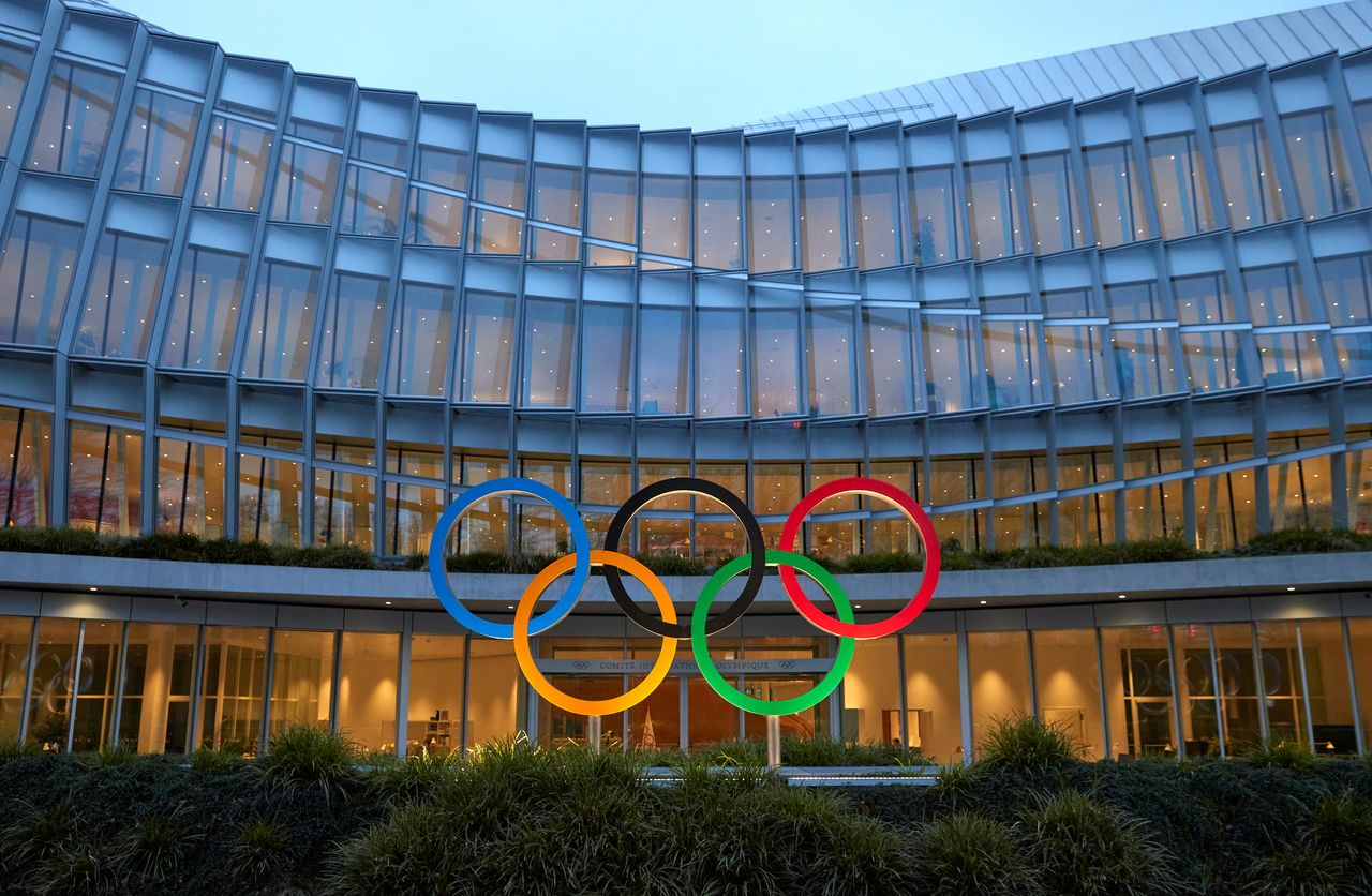 FILE PHOTO: The Olympic rings are pictured in front of the International Olympic Committee (IOC) headquarters during the coronavirus disease (COVID-19) outbreak in Lausanne, Switzerland, December 7, 2020. REUTERS/Denis Balibouse