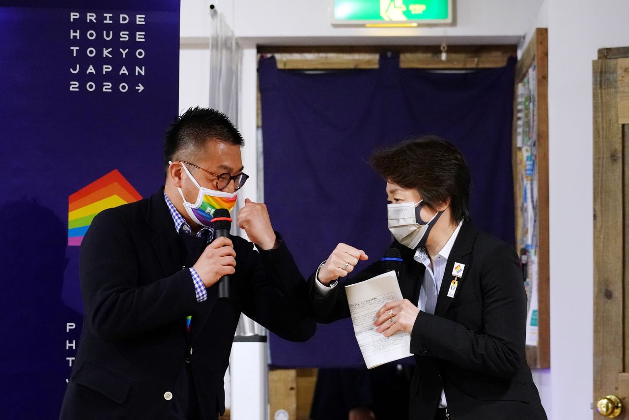Tokyo 2020 President Seiko Hashimoto bumps elbows with Head of Pride House Tokyo Legacy, Gon Matsunaka, in Tokyo, Japan April 27, 2021. Eugene Hoshiko/Pool via REUTERS