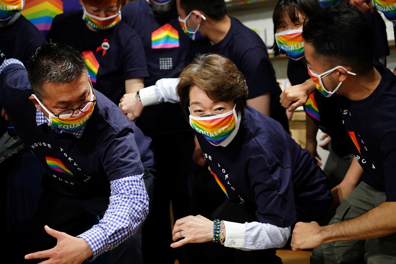 Tokyo 2020 President Seiko Hashimoto poses with representatives, staff and guests during a visit to Pride House Tokyo Legacy, in Tokyo, Japan April 27, 2021. Eugene Hoshiko/Pool via REUTERS