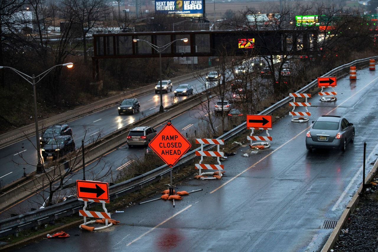 FIEL PHOTO: Cars drive along the NJ 495 route while road work signs are seen on the roadside, in Union City, New Jersey, U.S. March 31, 2021. REUTERS/Eduardo Munoz