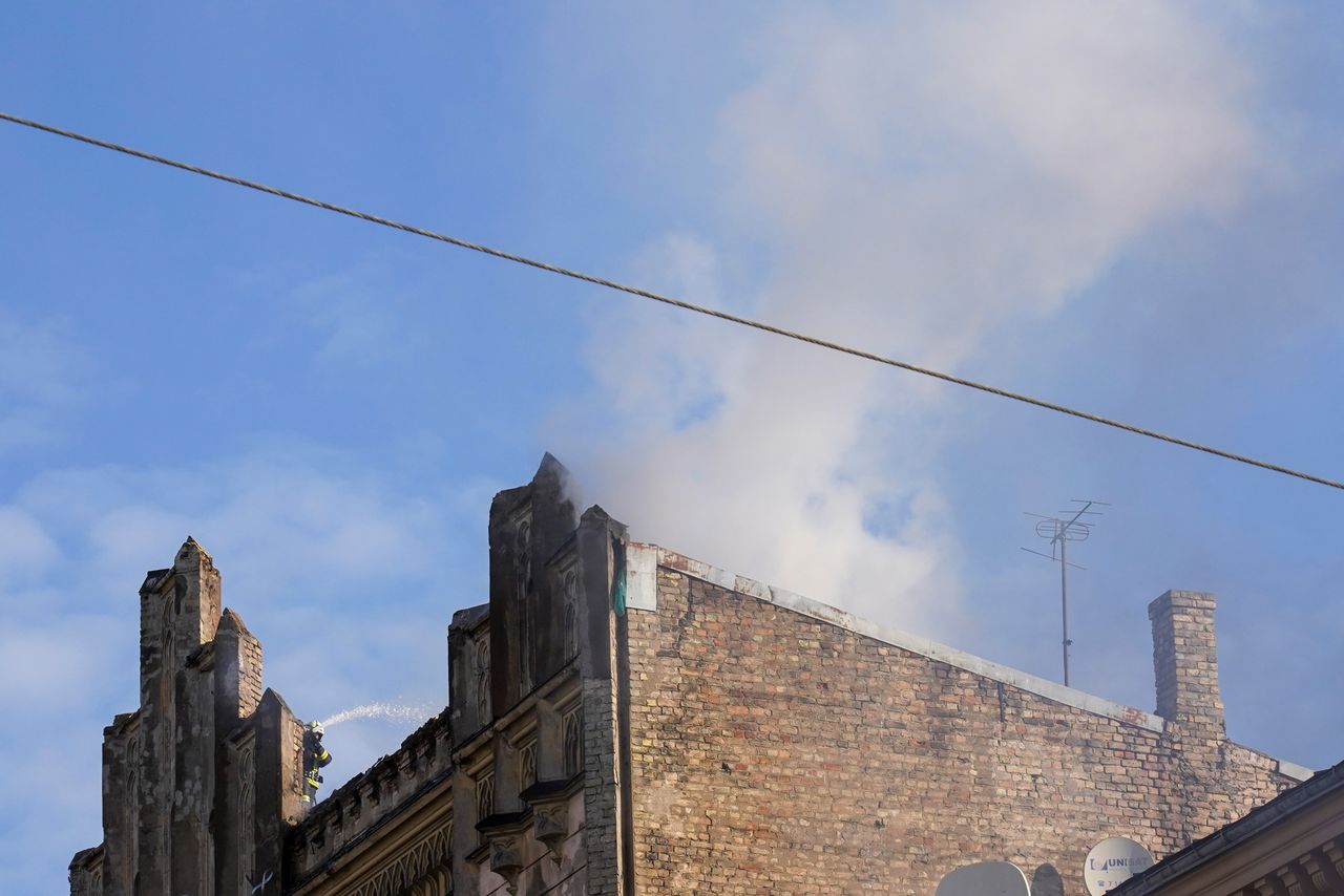 Smoke billows from the hostel where a fire broke out, in Riga, Latvia April 28, 2021. REUTERS/Janis Laizans