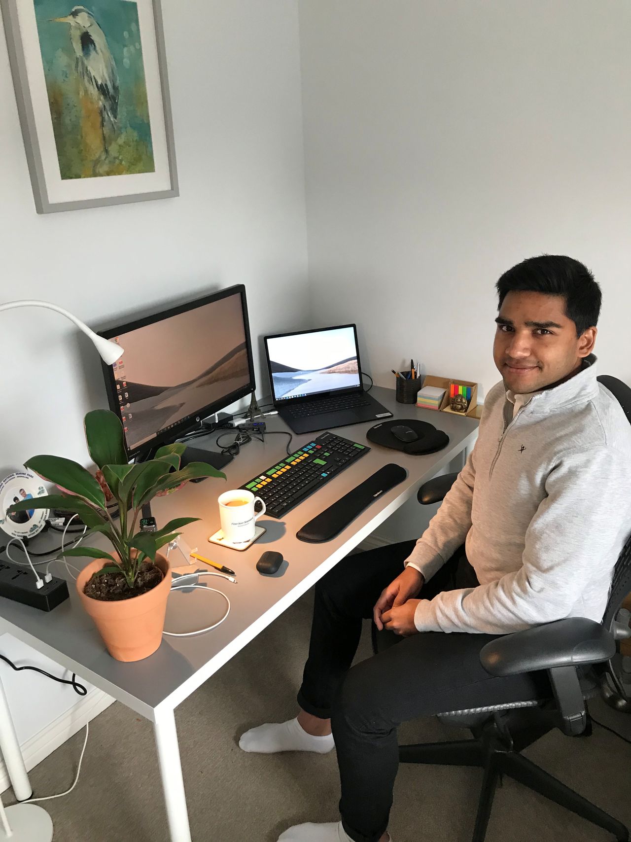 Analyst Adi Patel is pictured at his desk in Edinburgh, Scotland, Britain April 2019 in this handout obtained by Reuters on April 27, 2021. Scott McQuiston/Handout via REUTERS