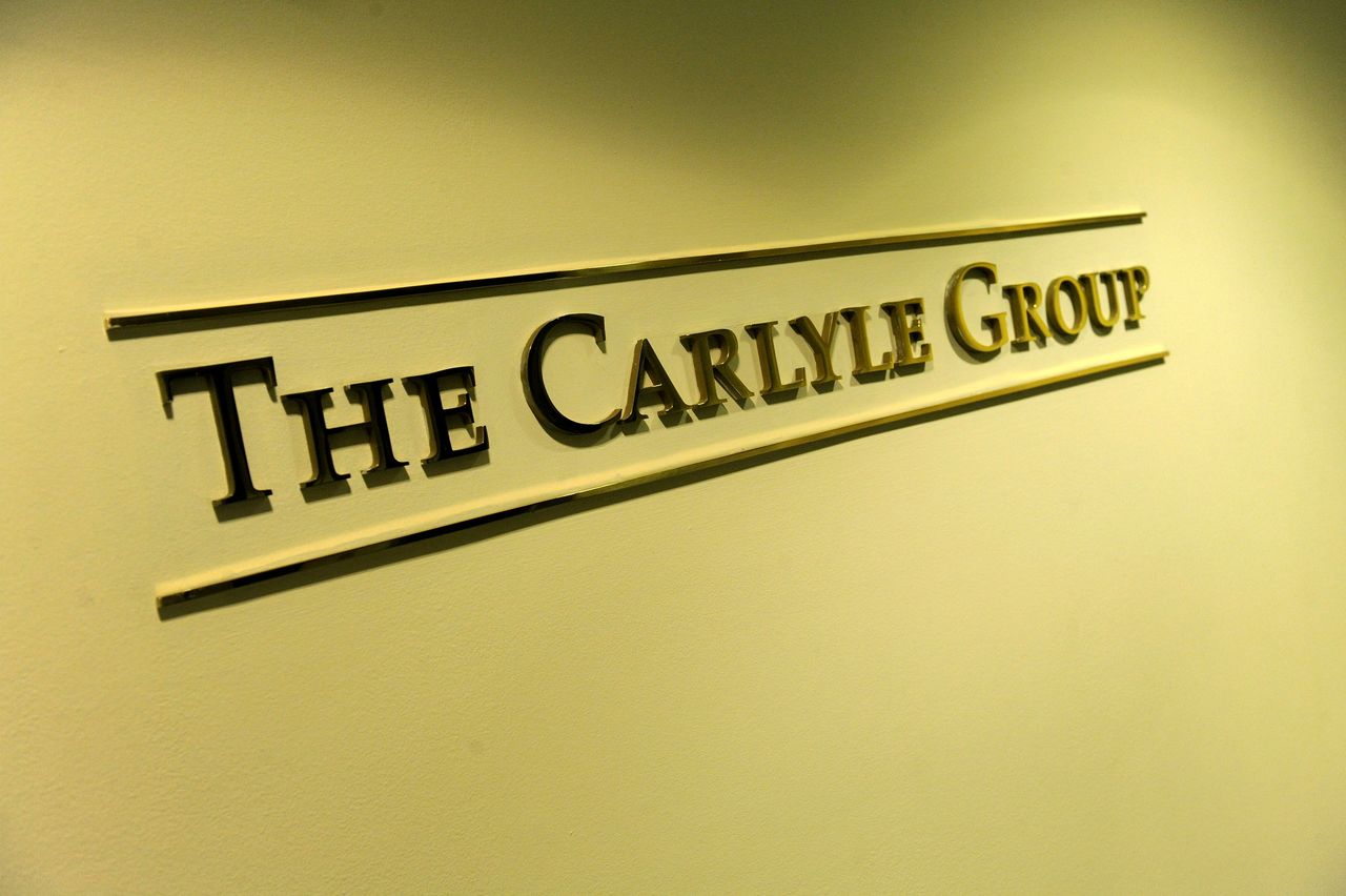 FILE PHOTO: A general view of the lobby outside the Carlyle Group offices in Washington, May 3, 2012. REUTERS/Jonathan Ernst