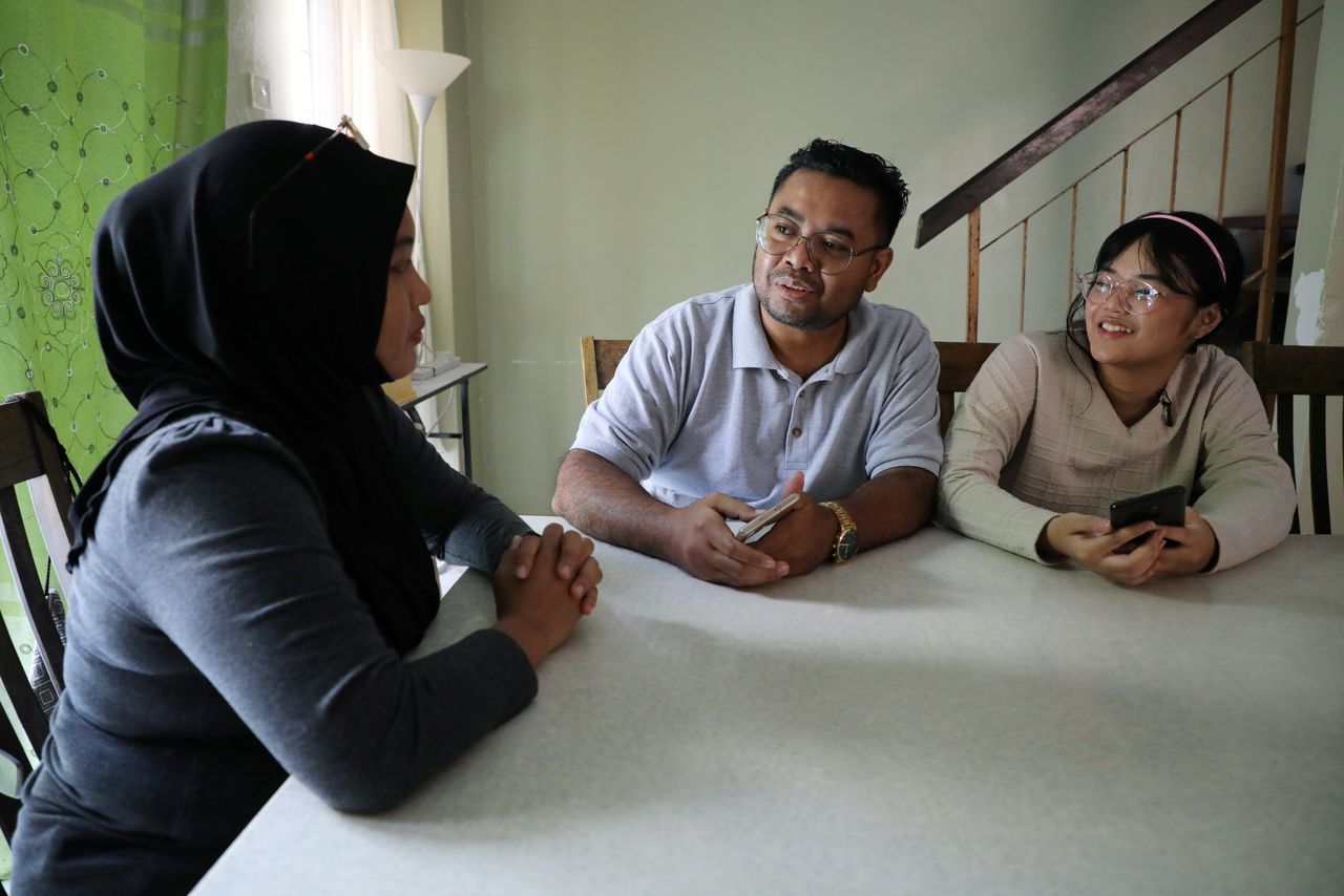 FILE PHOTO: Malaysian teenager Ain Husniza Saiful Nizam speaks to her parents at her home in Kuala Selangor, Malaysia April 29, 2021. REUTERS/Lim Huey Teng