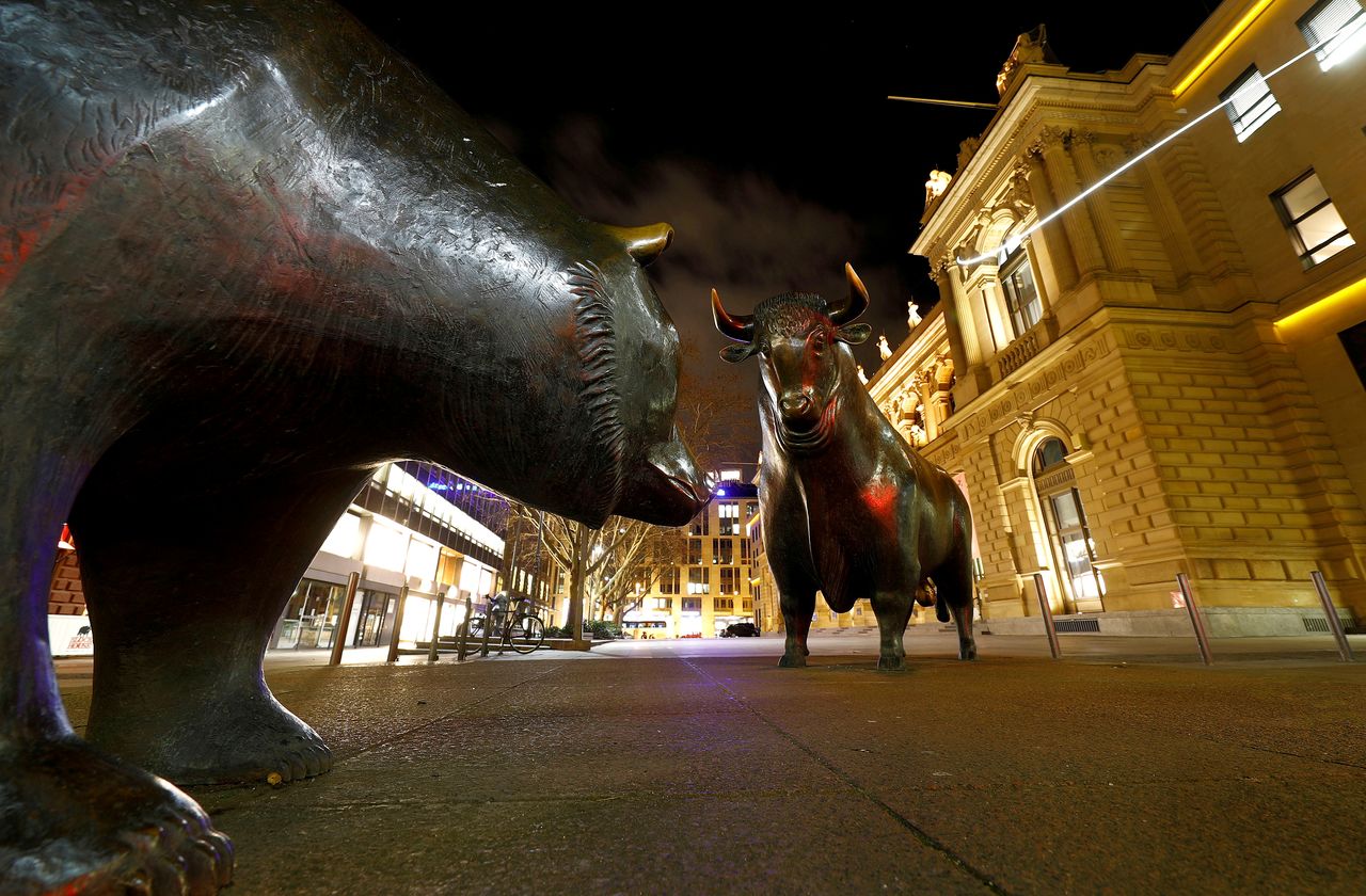 FILE PHOTO: Bull and bear symbols are seen in front of the German stock exchange (Deutsche Boerse) in Frankfurt, Germany, February 12, 2019. REUTERS/Kai Pfaffenbach