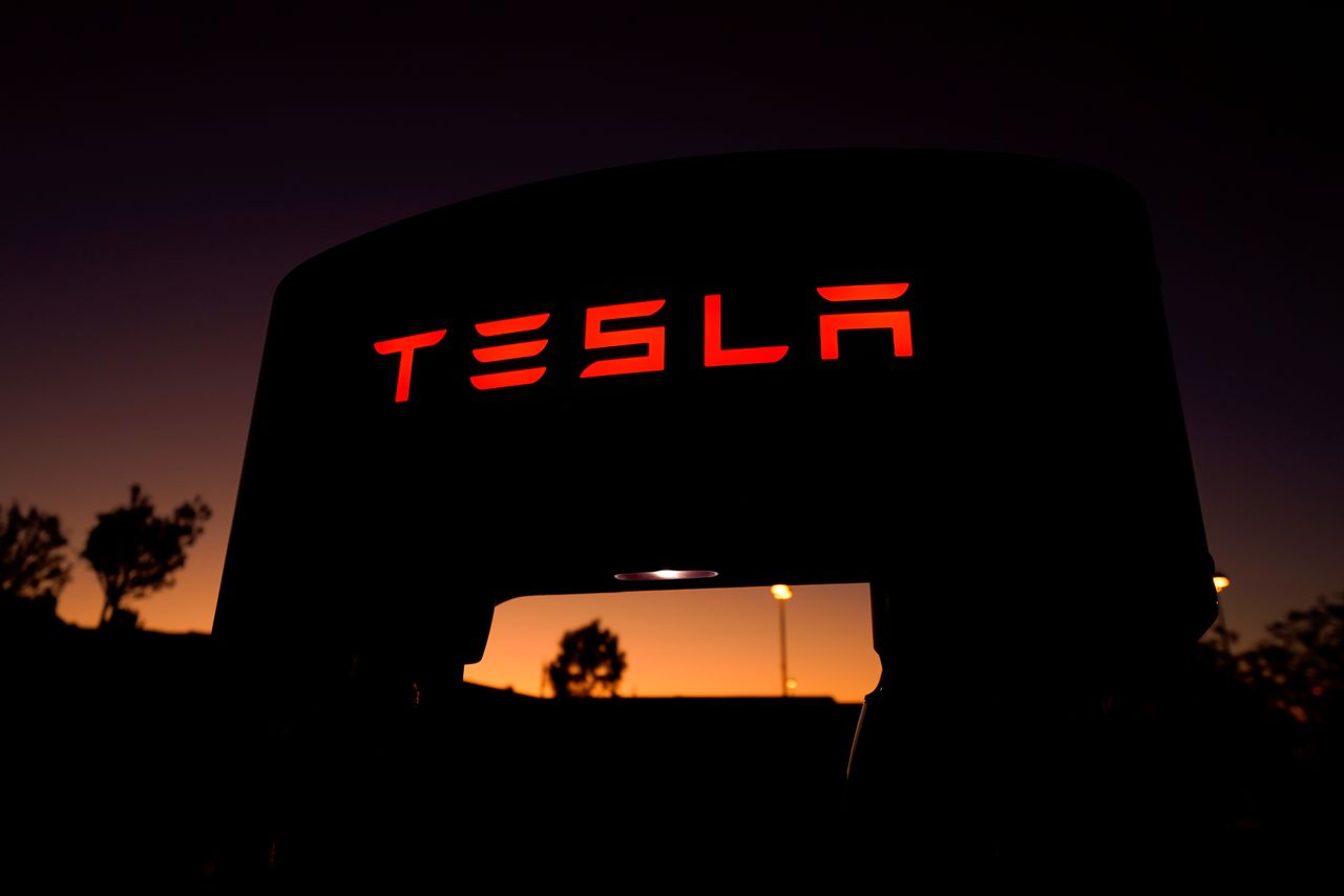 FILE PHOTO: A Tesla supercharger is shown at a charging station in Santa Clarita, California, U.S. October 2, 2019. REUTERS/Mike Blake/File Photo