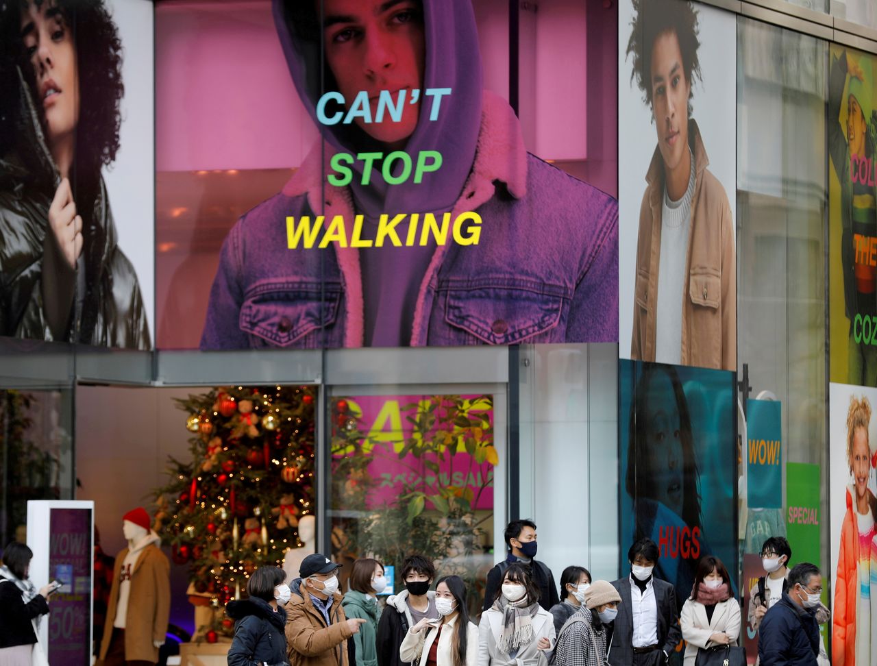 FILE PHOTO: People wear protective masks in a shopping district amid the coronavirus disease (COVID-19) outbreak in Tokyo, Japan, December 14 , 2020. REUTERS/Kim Kyung-Hoon