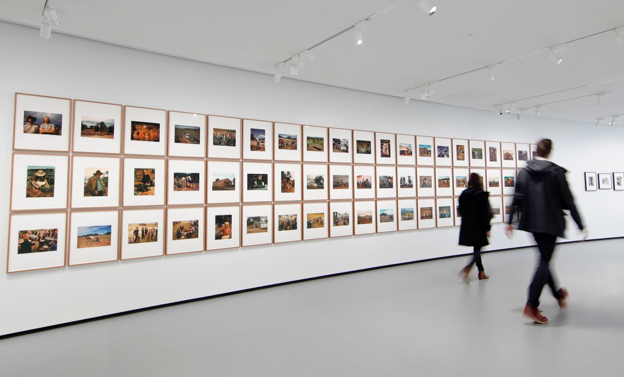 People walk past the installation of photographs by Sherrie Levine in Gallery 3, dedicated to photography, during a press visit at the Bourse de Commerce - Pinault Collection contemporary art museum in Paris, France, May 14, 2021. REUTERS/Sarah Meyssonnier