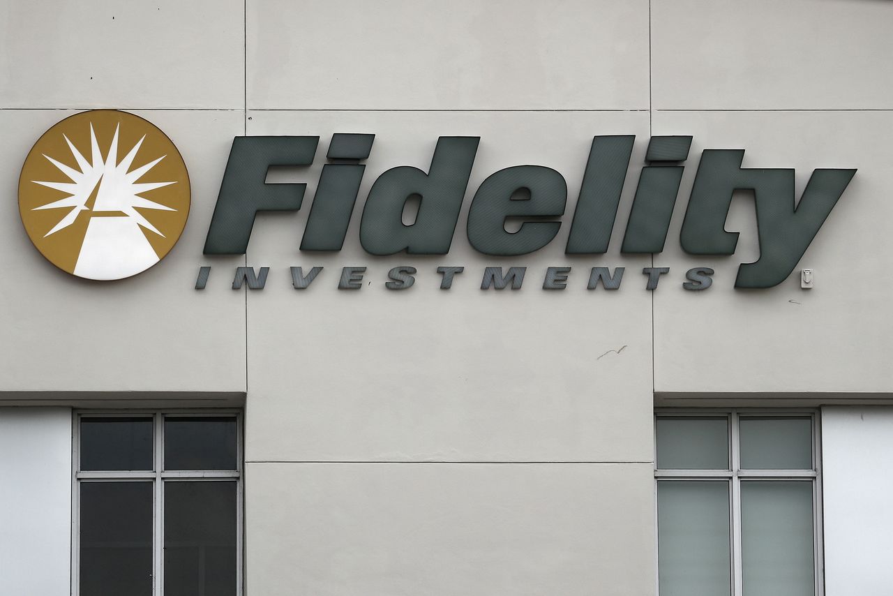 FILE PHOTO: A Fidelity Investments store logo is pictured on a building in Boca Raton, Florida March 19, 2016. REUTERS/Carlo Allegri