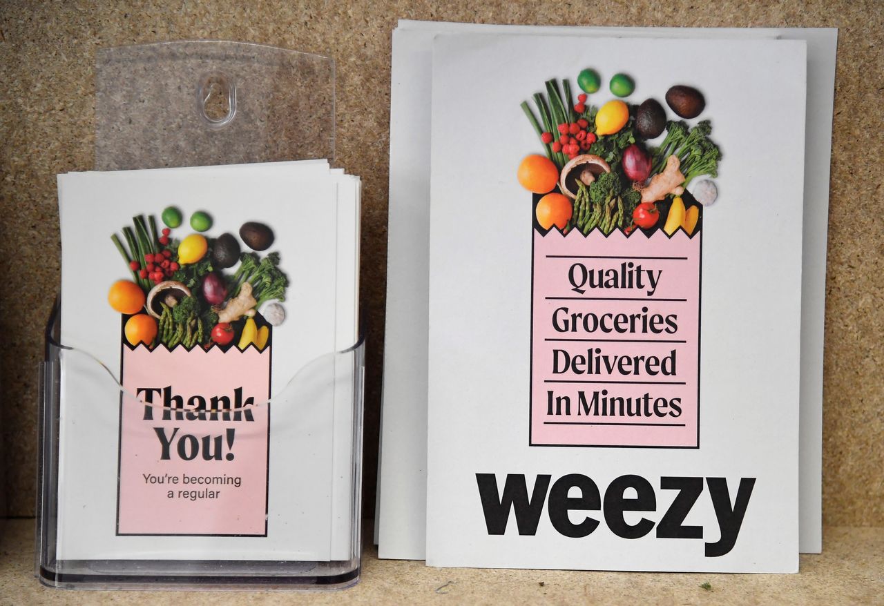 Promotional leaflets for online supermarket Weezy are seen at their Lambeth depot, amidst the expansion of rapid grocery delivery firms, London, Britain, May 12, 2021. Picture taken May 12, 2021. REUTERS/Toby Melville